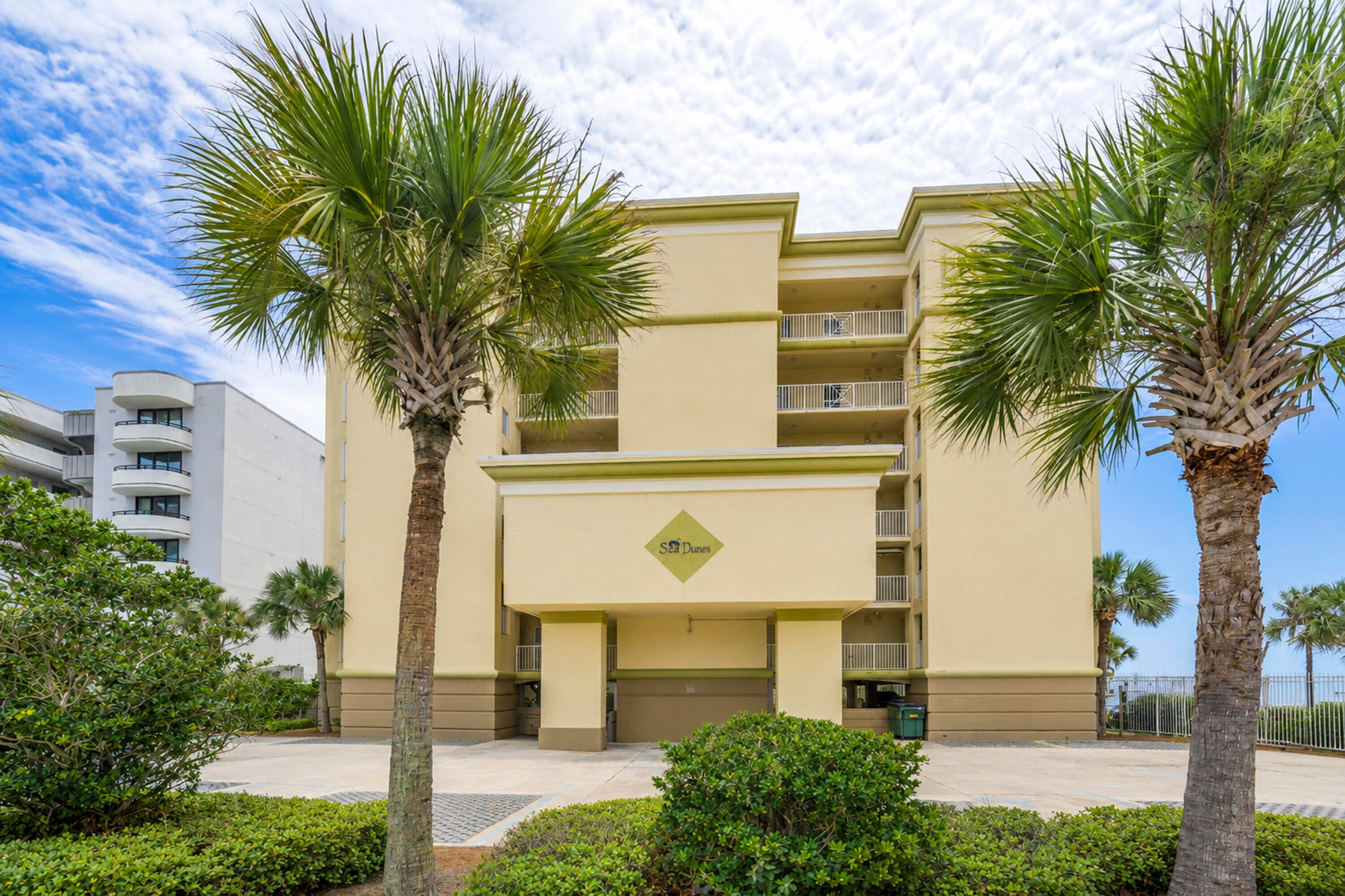 Experience Gulf-front living at Sea Dunes Condo #304, a beautifully furnished 3-bedroom, 3-bath corner residence located directly on the sugar-white sands of Okaloosa Island. This spacious condominium offers breathtaking panoramic views of the Emerald Coast, with an open-concept layout designed to maximize natural light and showcase the stunning Gulf views from the living areas and primary suite. The well-appointed kitchen flows seamlessly into the dining and living spaces, creating the perfect setting for entertaining. Floor-to-ceiling windows and sliding glass doors open to an expansive wraparound balcony where you can enjoy morning coffee, coastal breezes, and unforgettable sunsets. The Gulf-front primary suite features private balcony access, spectacular water views, and an ensuite bath, while two additional bedrooms and baths provide comfortable accommodations for family and guests. Sea Dunes is a highly sought-after, low-density beachfront community with only 24 residences, offering a more private and relaxed coastal experience. Amenities include a Gulf-front pool, private beach access, covered parking, grilling area, and outdoor shower. Conveniently located near the Okaloosa Island Boardwalk, Gulfarium, fishing pier, restaurants, shopping, and entertainment, Sea Dunes 304 is ideal as a primary residence, vacation home, or income-producing investment property. Enjoy the best of the Emerald Coast from this exceptional beachfront retreat.