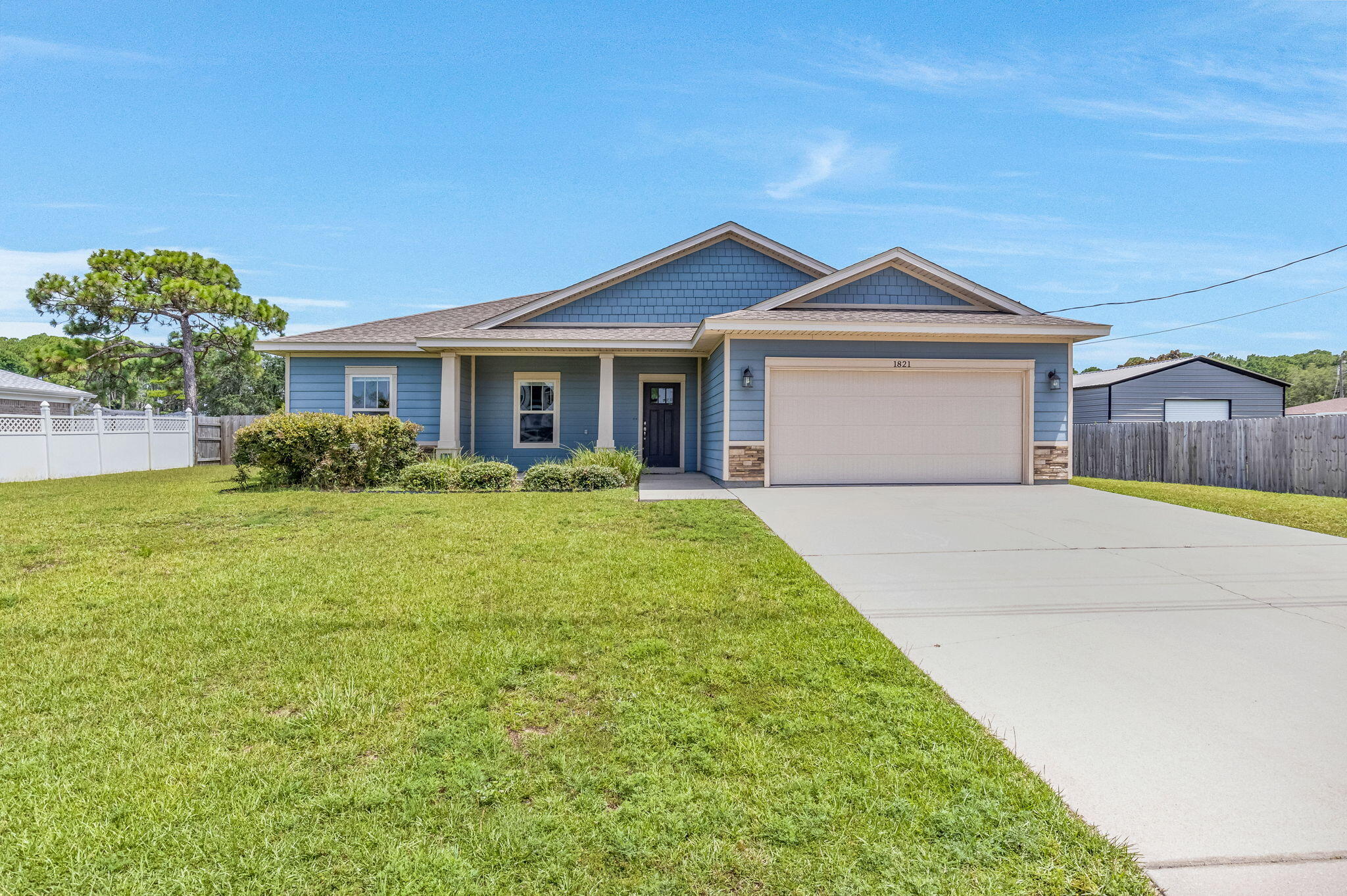 3.5% VA Assumable Loan!! OPEN HOUSE SATURDAY 12-3 AND SUNDAY 1-3! Exceptional home in a prime East Navarre location, just two minutes from Publix and five minutes from Navarre Beach! Situated on nearly half an acre, the property features a sprinkler system, a fenced backyard, and additional yard space extending beyond the fence into the wooded area.
Inside, you'll find wood-look laminate flooring throughout the main living areas, tile in the bathrooms and laundry room, and carpet in the bedrooms. Neutral paint, wide baseboards, beautiful crown molding, elegant tray ceilings in the primary bedroom, dining room, and foyer, plus transom windows above the hallway entrances add a polished, custom feel.
The kitchen is beautifully finished with stainless steel appliances, including the refrigerator, mocha shaker-style cabinetry, and granite countertops. With its spacious lot, thoughtful upgrades, and unbeatable location, this home is a must-see!