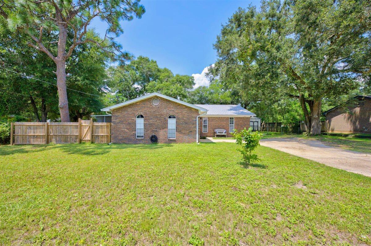 Every inch of this Pensacola home has been thoughtfully updated, offering modern finishes and major improvements throughout! (See MLS documents for the complete list of upgrades). With a 2023 roof, HVAC system, and water heater, you'll have peace of mind from day one. The driveway has plenty of parking and a gravel extension has been added in the backyard - perfect for parking a boat or RV! Inside, you'll find a bright, modern interior with luxury vinyl plank flooring throughout, crisp neutral paint, and beautiful wood doors and trim that add warmth and character. The updated kitchen is equipped with Samsung black stainless steel appliances, abundant white cabinetry, quartz countertops, and a nearby pantry for additional storage. Just off the kitchen, the formal dining room is filled with natural light from a large double window, while the spacious living room provides an inviting space for everyday living and entertaining. A generously sized screened porch extends the living space outdoors. The backyard has been enhanced with fresh sod, a new privacy fence, and a dedicated fire pit area, with plenty of room for grilling, gardening, outdoor games, or simply enjoying the shade. All three bedrooms are tucked away in a private hallway. The primary suite features two closets and an updated ensuite bathroom with a walk-in shower. Two additional bedrooms, each with ceiling fans and closets, share a remodeled bathroom with a tub/shower combination. Both bathrooms have been updated w ith new vanities, quartz countertops, and modern shower finishes. The home also includes a one-car garage with a dedicated work area and washer and dryer hookups. Situated in a central Pensacola location with no HOA, this move-in-ready home offers extensive updates, functional living spaces, and a backyard that's ready to enjoy!