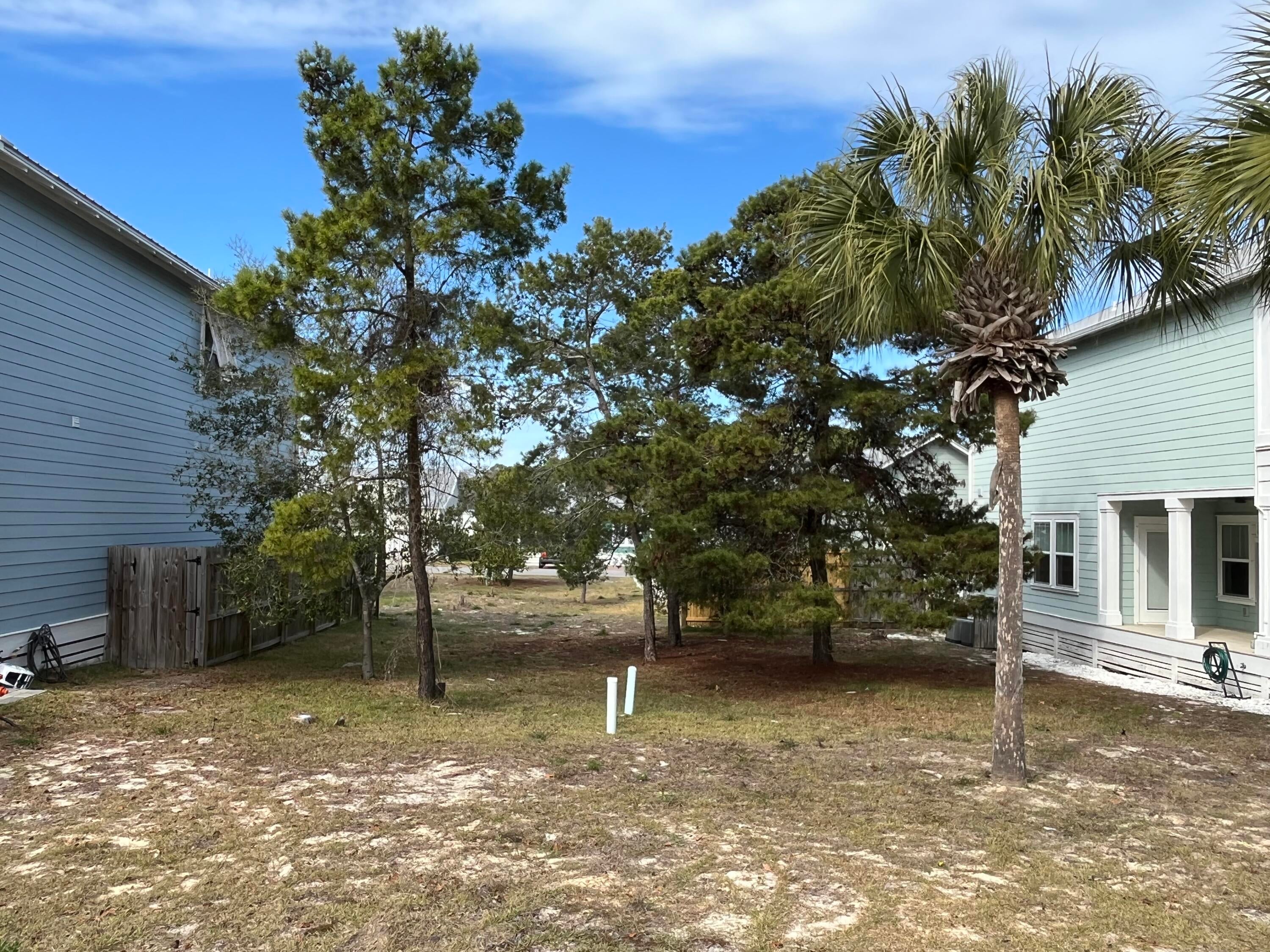 Build your dream beach home in Paradise Grove, a non short term rental community on the west end of Panama City Beach. This cleared, build-ready lot is located in a charming neighborhood of cottage-style homes and offers an excellent opportunity to create your own coastal retreat. Residents enjoy a gated entrance, well-maintained common areas, and a community pool. Conveniently located just four blocks from the beach, minutes from Pier Park, and a short drive to 30A and Northwest Florida Beaches International Airport, this property offers the perfect setting for a primary residence, second home, or long-term investment on the Emerald Coast.