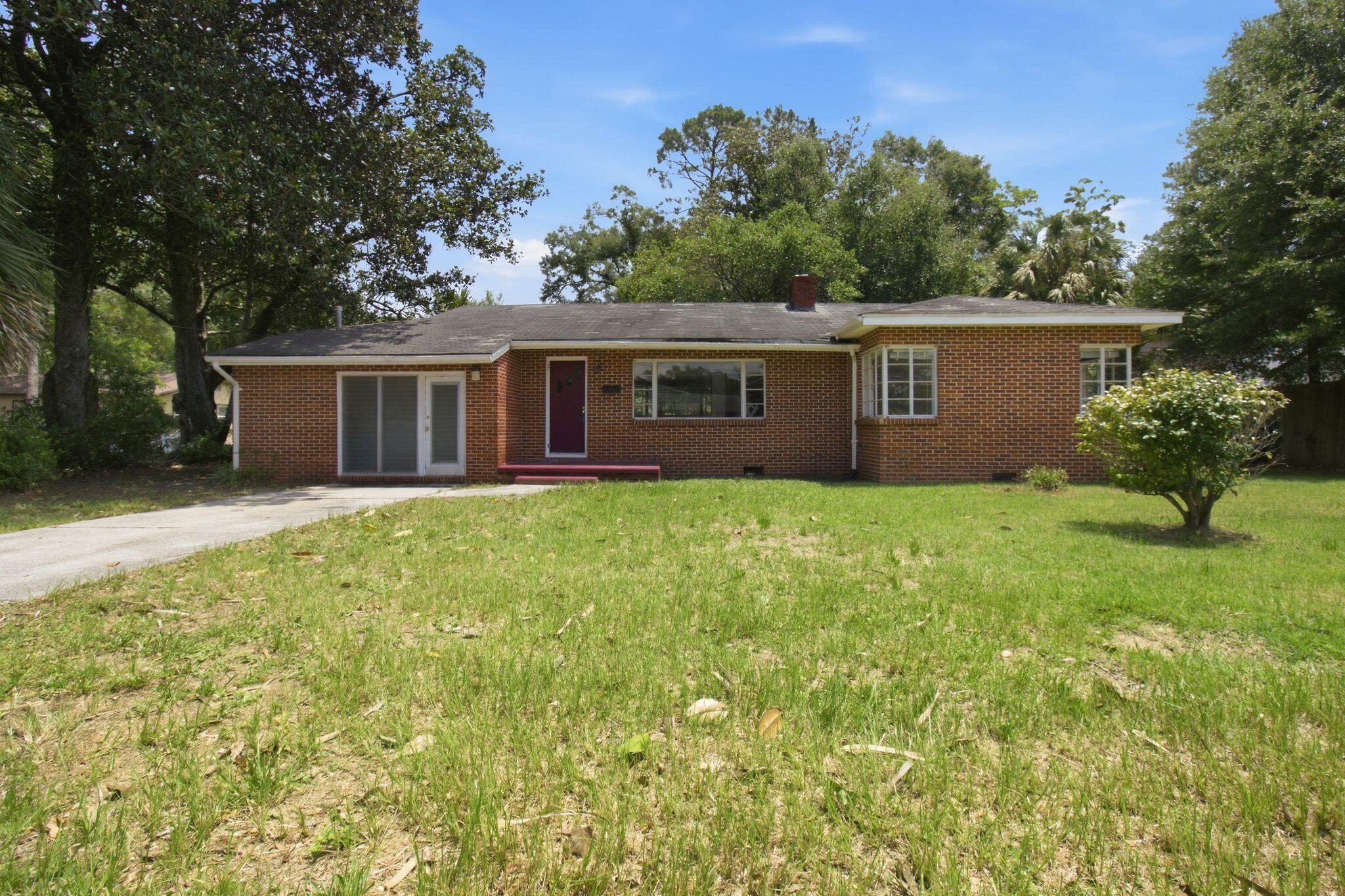 Step into a piece of Crestview history with this distinctive 1948 brick home, a vintage example of the transition from the elegant Late Colonial Revival era to the emerging Traditional Ranch style. Considered a high-end design when built, this home showcases architectural details that are increasingly rare and well worth preserving.
Offering 3 bedrooms, 2 bathrooms, a dedicated laundry room, and two separate living areas, the spacious floor plan provides endless possibilities for homeowners, investors, entrepreneurs, and design enthusiasts alike.
At the heart of the home, a striking fireplace serves as the main focal point, beautifully representative of late-1940s craftsmanship with its original wood-paneled chimney breast. Additional period details include built-in shelving with decorative openings between rooms, creating character, charm, and a sense of architectural distinction rarely found in modern construction.
Designed to maximize natural light, the home features an impressive collection of original windows, including rare original steel casement corner windows in two of the three bedrooms, large picture windows in both the living room and dining room, and original jalousie windows that reflect the home's vintage Florida heritage. Together, these elements create bright, inviting spaces while preserving the home's authentic character. Situated on a generously sized lot shaded by mature native trees, the property offers ample parking, rear alley access, and plenty of room to expand your vision.
Beyond its residential appeal, this property presents a unique investment opportunity. The City of Crestview's Future Land Use designation of Multi-Use (MU) (Table 4.06.00) allows for a variety of residential and commercial possibilities. Whether you envision a beautifully restored residence, professional office, boutique retail space, studio, gallery, or mixed-use investment, the flexibility is already in place.
With its combination of architectural significance, prime visibility, accessibility, and future potential, this is far more than a home--it's an opportunity to create something truly special. Consider renovation financing and bring your vision to life. Call your Realtor today!