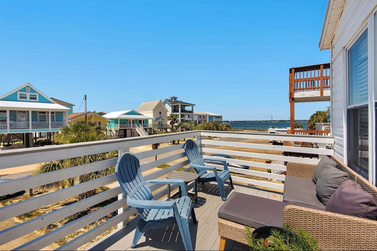 COASTAL LUXURY MEETS INVESTMENT OPPORTUNITY AT NAVARRE BEACH

Rarely does a property come to market that blends luxury coastal living, income-producing potential, and true versatility quite like this one. With a projected annual rental income of approximately +$75,000 ($65,000 in 2026 Bookings to Date), this exceptional Navarre Beach retreat is more than just a home - it is an opportunity to own one of the most unique and strategically designed properties on the island.

The upper level features 3 bedrooms and 2 beautifully appointed bathrooms, thoughtfully designed for comfortable full-time living or an elevated vacation experience. Downstairs offers a completely autonomous 2-bedroom suite with a full kitchenette, creating the ideal setup for short-term rental income, multi-generational living, guest accommodations, or private owner flexibility.

Step outside into your own private coastal oasis where a resort-style pool, expansive entertaining space, and peaceful water views create the perfect backdrop for unforgettable mornings and sunset evenings. Every detail of this property was designed to maximize enjoyment, functionality, and return on investment.

Additional features include an electric vehicle charging station, no HOA restrictions, and the rare freedom and flexibility that discerning buyers are searching for but seldom find at the beach. Whether you are seeking a high-performing investment property, a luxury second home, or a one-of-a-kind primary residence, this is a must-see property that stands apart from anything else currently available on Navarre Beach.
