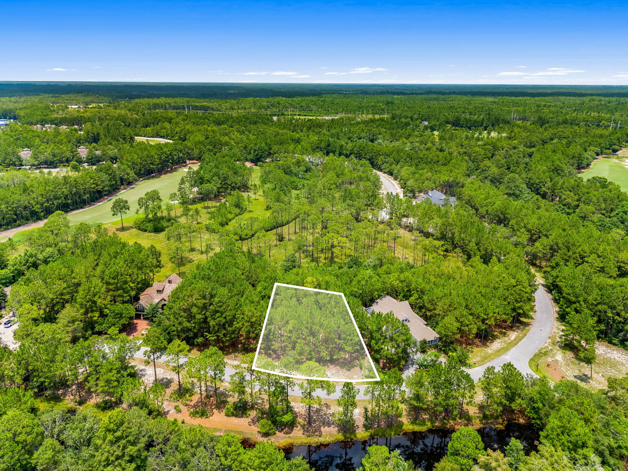 Discover the perfect opportunity to build your dream home in the prestigious gated community of Wild Heron. Located at 1509 Sweetbay Trail, this beautiful homesite is tucked away on a quiet street and offers exceptional privacy, surrounded by mature pines and native Florida landscape. The generous lot provides an ideal setting for a custom home while preserving the peaceful, natural beauty that makes Wild Heron so special.

Enjoy easy access to world-class amenities, including, community pool, hot tub, firepit, grill, fitness center, boat house, and access to Lake Powell; Florida's largest coastal dune lake. Miles of walking and biking trails weave throughout the community, creating the perfect balance of luxury living and outdoor recreation.

Conveniently located just minutes from the white-sand beaches of the Gulf, Scenic Highway 30A, Pier Park, dining, shopping, and Northwest Florida Beaches International Airport, this is a rare opportunity to own property in one of Panama City Beach's most sought-after gated communities.

Build the custom home you've always envisioned and experience the unmatched lifestyle that only Wild Heron has to offer.