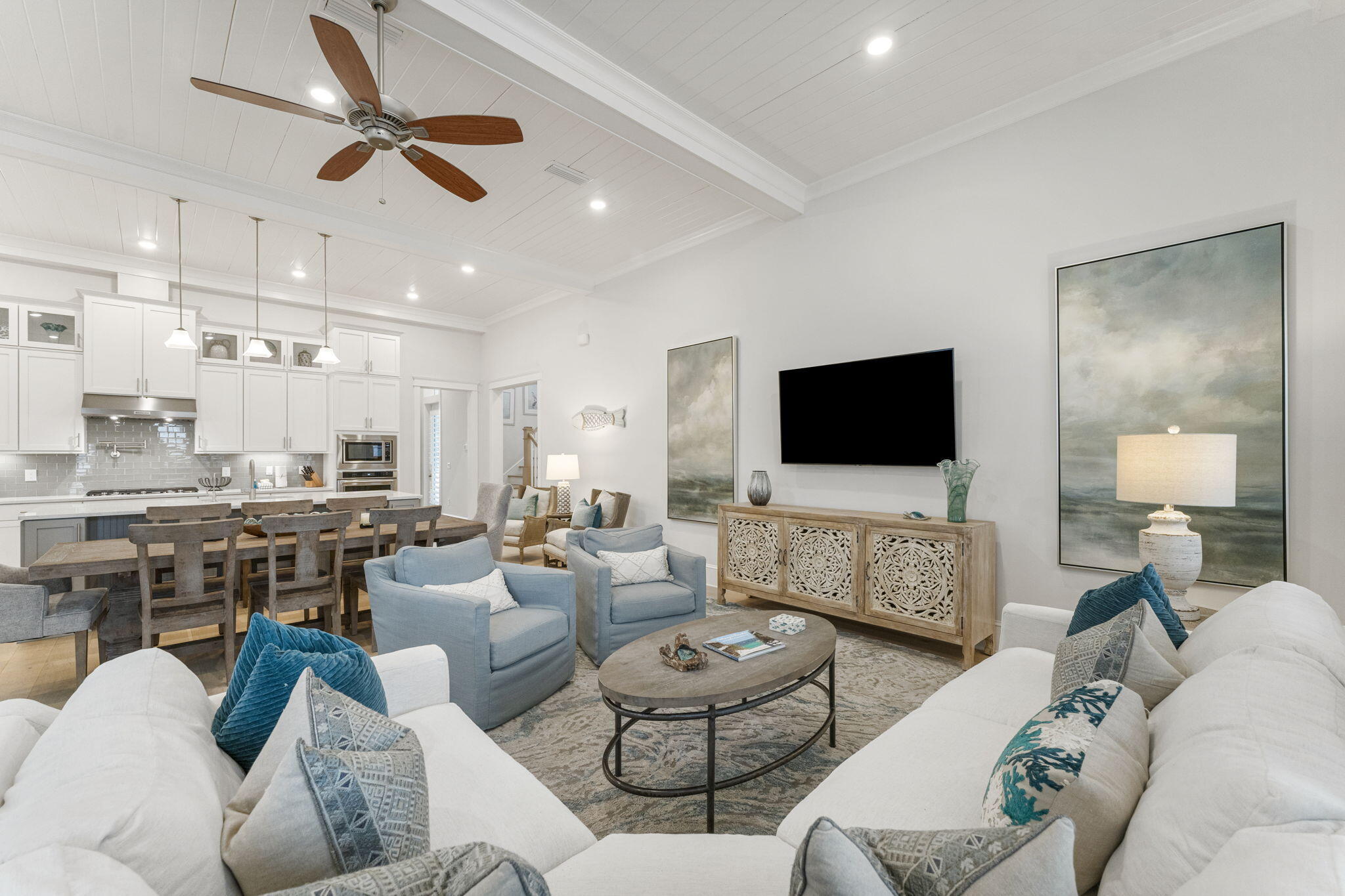 Luxury abounds in this beautifully appointed coastal home. Fully furnished to enjoy as a second home or incredible investment opportunity. Ideally situated on 30A, this home puts you in the epicenter of activity, while providing the peace and tranquility only a view of the sunset and waves can provide. The soaring 14-foot ceilings welcome you into an elegant and spacious family room with custom shutters, hardwood floors, and charming shiplap accent walls throughout. The Laguna floorplan encourages family gatherings with two master suites, one located conveniently on the first floor and the other on the second floor with a large balcony and gulf view.  Enjoy hours of fun with friends and family on the custom extended back patio.