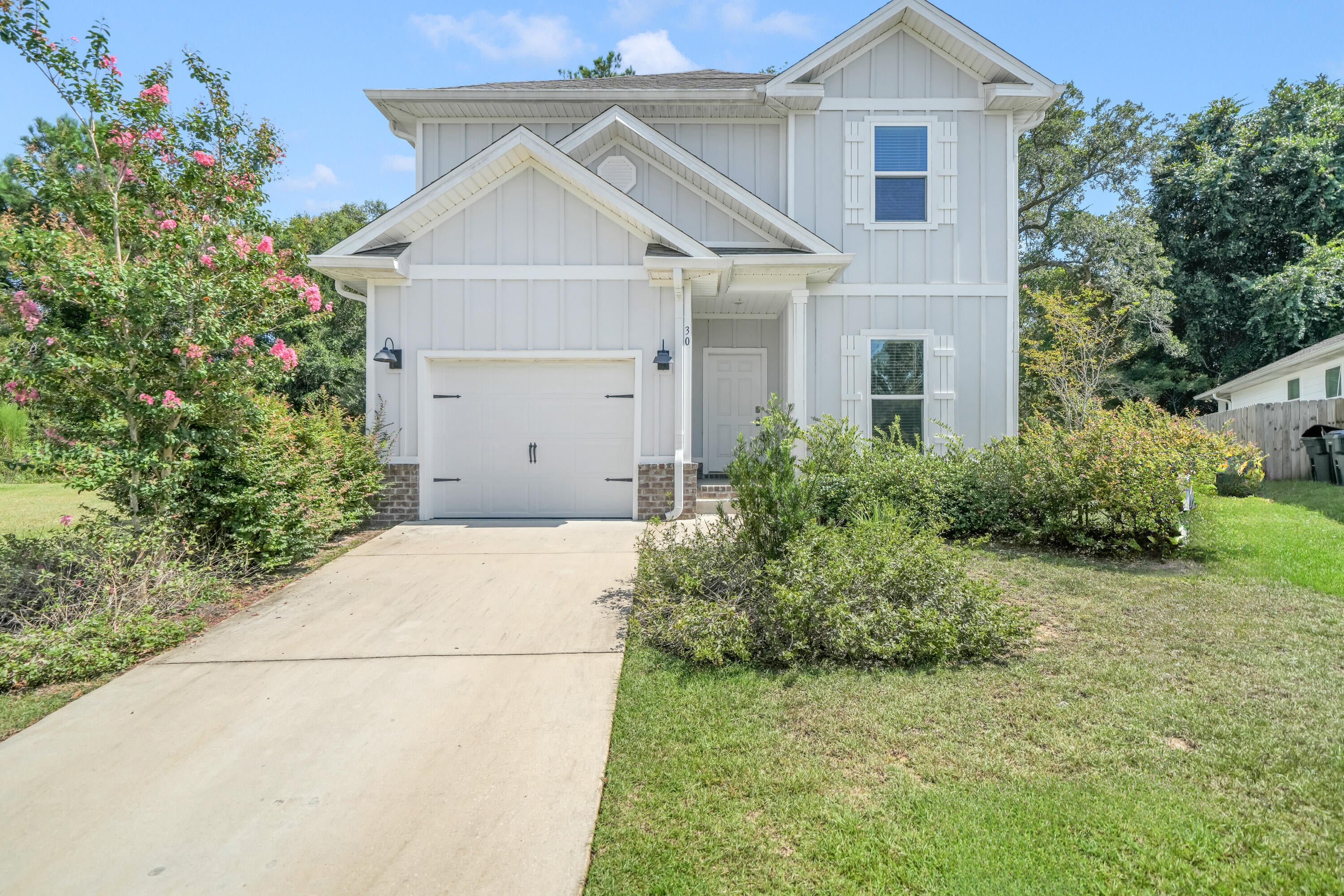 Welcome to LaGrange Landing! This charming neighborhood is home to this like-new 4 bed, 3.5 bath home, offering a spacious and functional floor plan.

Outside, enjoy a cul-de-sac lot with a private, wooded backyard filled with mature trees. The covered patio is the perfect spot for grilling and relaxing. The durable Hardie board exterior adds lasting appeal, while the home was built in 2023, providing the benefit of newer major systems and features.

Inside, the open kitchen offers generous cabinetry, a pantry and center island, flowing seamlessly into the large family room. The first level also features a private bedroom with a large walk in closet and its own bathroom. The laundry is conveniently located downstairs, and the washer and dryer convey. Upstairs, you'll find three additional bedrooms and two additional bathrooms, along with a flex room offering space for a media room, playroom, office or second living area.

LaGrange Landing is a charming neighborhood with sidewalks, a community pool and a private dock with fishing and kayak/paddle access to the Choctawhatchee Bay. Conveniently located near 331 and Highway 20, you're just a short drive from the beaches of 30A, local shopping, restaurants and the amenities you need for everyday life. Don't miss the opportunity to make this spacious home your own - schedule your showing today!