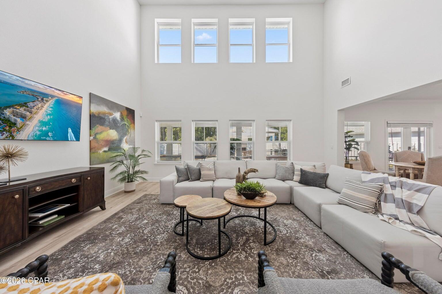 HIGHEST COMPS SOLD IN THE NEIGHBORHOOD!!!

Some homes are listed--this one makes a statement. Fully upgraded and designed for entertaining on a rare half-acre corner lot. The sought-after Elliot floor plan features a first-floor primary suite for comfort and privacy. A chef-inspired kitchen with quartz countertops, a large island, and an open flow anchors the home. Enjoy not one but two spacious living areas for relaxing or hosting. Upgrades include luxury vinyl flooring, modern finishes, and a custom wine and beverage station with built-in storage and fridge. Step outside to screened porches, paver upgrades, an outdoor kitchen with a premium grill, and a pavilion with seating and a fireplace. Spacious, private, and close to beaches, dining, and shopping--this is coastal living elevated.