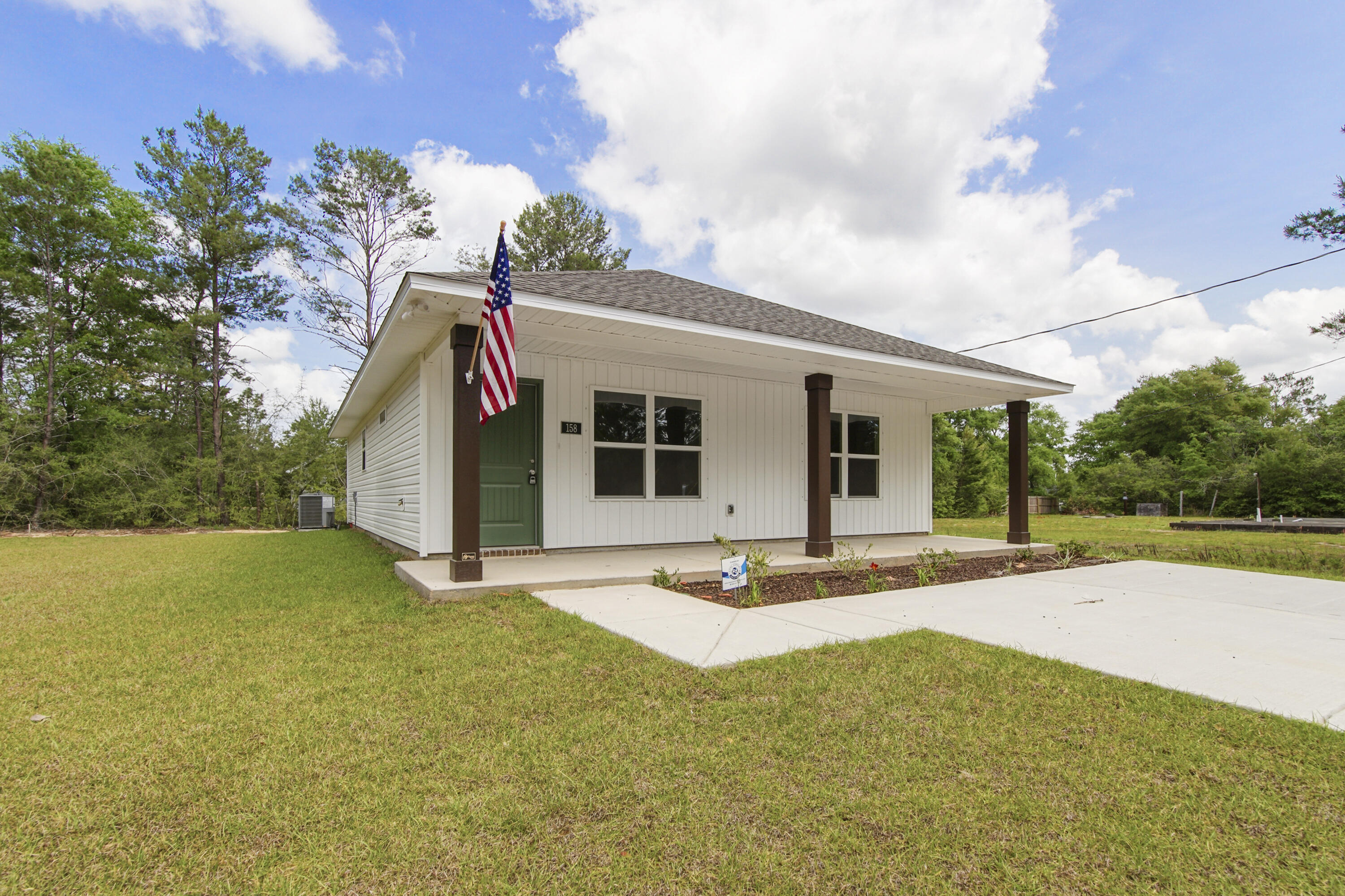 Fresh, simple, and easy to love. This newly built home by Flynn Built with NO HOA draws you in with an expansive front porch and offers 2 beds/2 baths with a light, open layout that feels comfortable and livable. Inside, you'll find durable LVP flooring throughout, granite countertops, stainless appliances, and a bright, airy feel that makes the space live larger than expected. The exterior features low-maintenance vinyl siding, making upkeep easy. Also included is a one-year builder warranty for added peace of mind. Plus, with a full-price offer, buyers receive $8500 toward closing costs, making this a super option for first-time buyers, those downsizing, or anyone looking for a clean, move-in ready start.