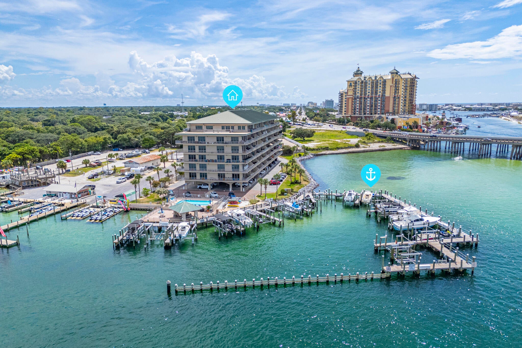 Boaters will appreciate the included, protected, 40' boat slip with quick access to the Gulf.  Welcome to Sides Moreno Point, an exclusive waterfront community, located at the base of the Destin Bridge overlooking the emerald waters of East Pass and Crab Island. This beautifully renovated 3 bed/3 bath residence offers a spacious open floor plan complemented by a large balcony with breathtaking water views, making it the perfect primary residence, second home, or investment property.   Extensively Renovated in 2024, featuring a Shiplap accent wall from the entry into the living room; LVP flooring throughout the living area, hallway, and kitchen; new carpet in all bedrooms and new tile throughout the bathrooms; and a luxurious primary bath with a redesigned layout, custom cabinetry, oversized walk-in rain shower, and bidet toilet.  The kitchen has been completely remodeled to include custom cabinetry; a large center island with abundant storage; stainless steel appliances; built-in drawer microwave and a Farmhouse sink plus additional bar sink.  (See the complete Renovation List in the Document Section).  Additional features include custom wood closet shelving and a convenient storage unit located on the same floor.  This exceptional waterfront residence combines luxury, location, and an unbeatable boating lifestyle. Don't miss this rare opportunity to own one of Destin's premier waterfront properties.