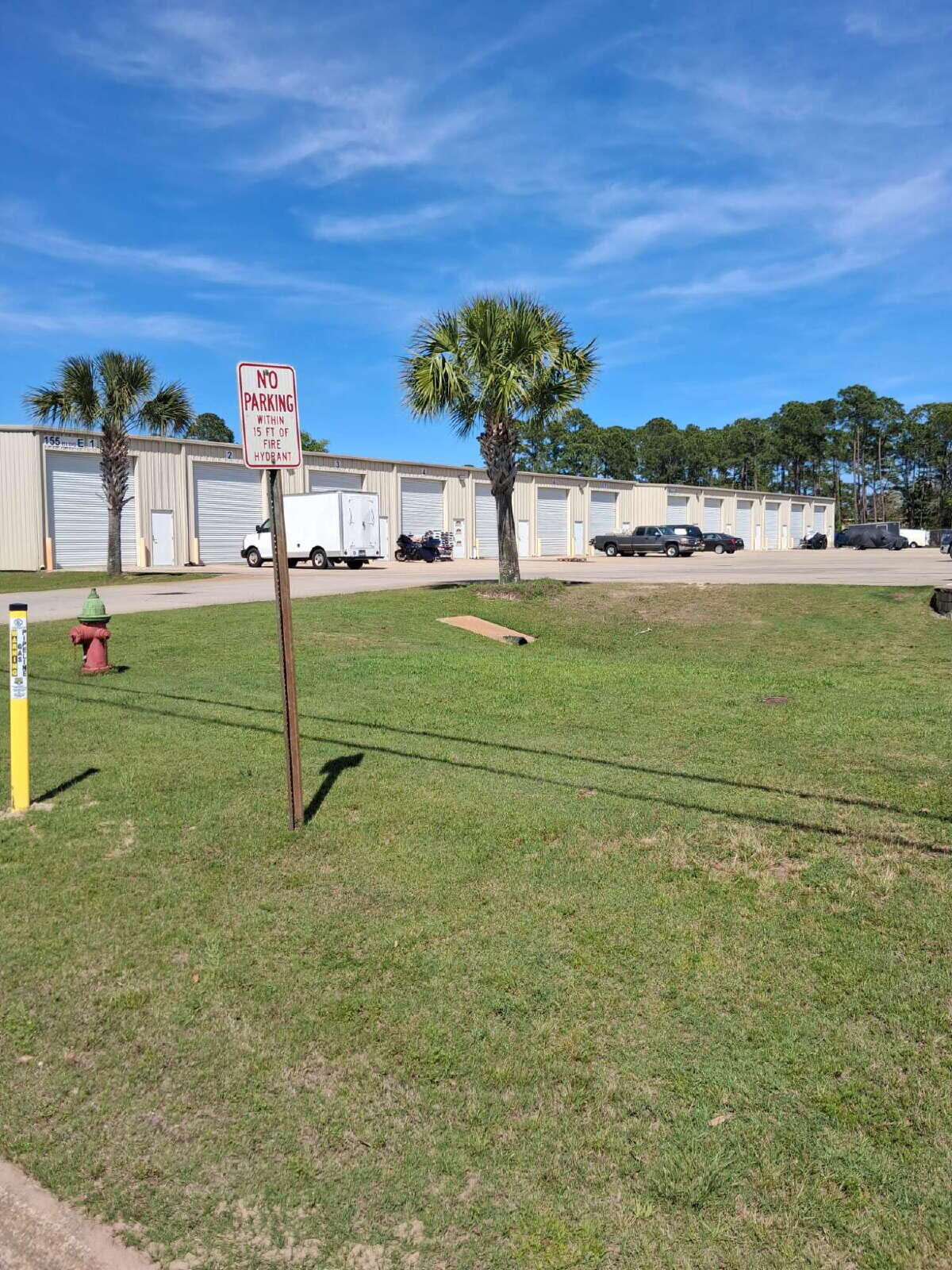 LIKE NEW 1000sf (20' wide x 50' deep) WAREHOUSE!  Unit/building was built in 2019 and is used for storage only.  The ceiling is 16ft high. It has a roll up door that is 12ft wide x 13.6ft high. There is a community bathroom for the 6 units in this building at the end of the building.  Go online, www.coastalrealtyservices.com to schedule a showing or call our office at 850-244-2100.