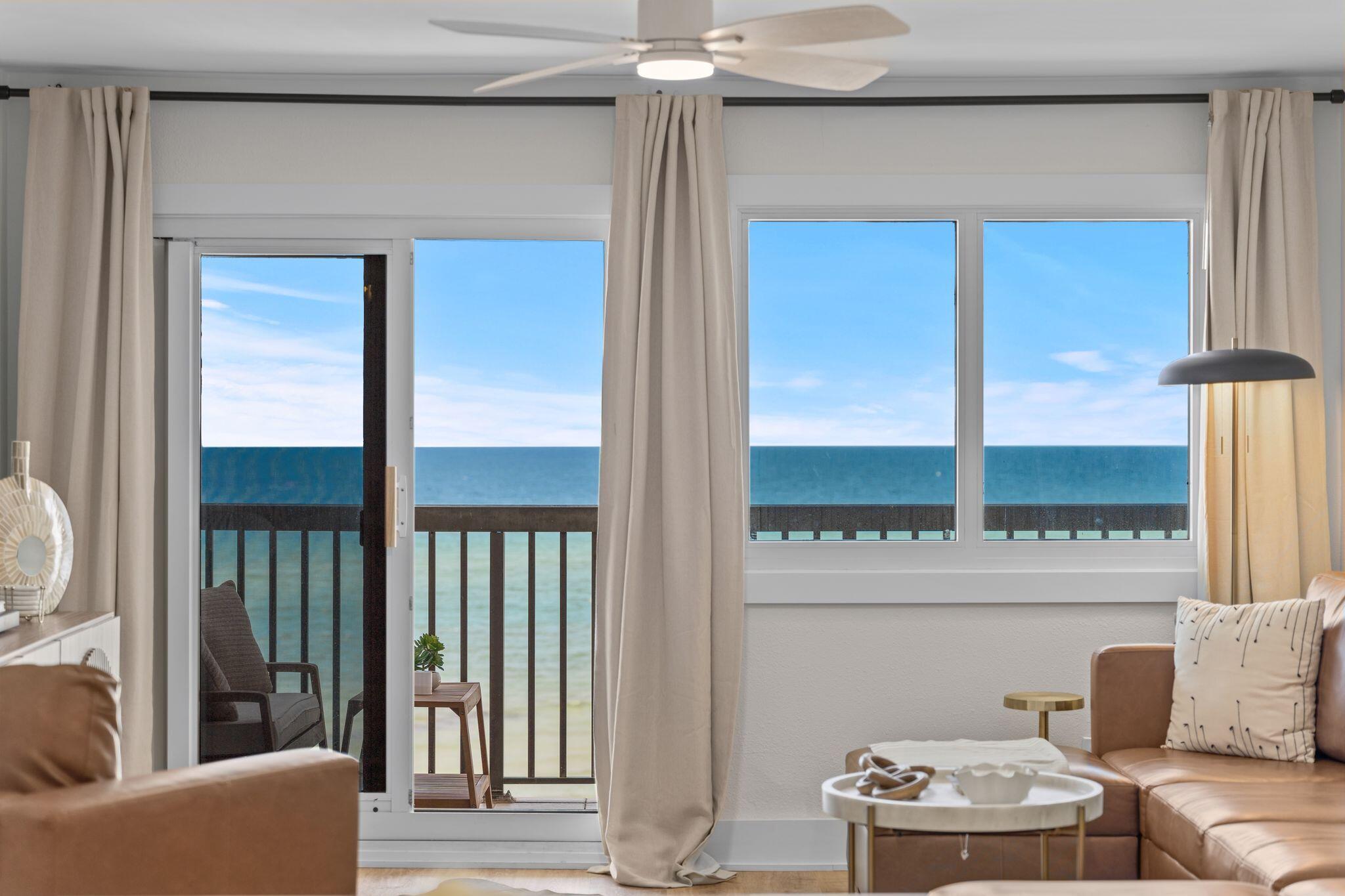 Rarely does a residence of this standard become available at Pinnacle Port, offering a seamless blend of modern design and coastal elegance. Freshly unveiled following a meticulous 2025 renovation, this one-of-a-kind condominium stands as a testament to coastal living where no detail was deemed too small. From the moment you step inside, the wide-plank flooring leads you through a space defined by curated luxury. The heart of the home is a chef's kitchen that marries form and function, featuring custom cabinetry designed to discreetly house small appliances with integrated power. Premium appliances, including a Bosch stainless steel range and dishwasher alongside a professional-grade Liebherr refrigerator, sits framed by quartz countertops and backsplash. The massive quartz waterfall island serves as a centerpiece in the kitchen and comfortably seats eight for entertaining. The creativity continues in the private quarters. The primary suite offers a serene retreat with sweeping, panoramic views of the Gulf of America, including a patent pending LuggageBerth storage cabinet and custom closet system, and an ensuite spa-like bathroom, while the guest suite showcases thoughtful craftsmanship with custom built-in beds, integrated reading lights, and USB connectivity. Throughout the home, designer sconces and ceiling fans complement a collection of all-new, hand-selected furniture and accessories. Whether you are enjoying the panoramic views of the Gulf of America from the private balcony or admiring the bespoke details and refined finishes, every inch of this residence is thoughtfully designed. This is more than a renovation; it is a complete reimagining of luxury on the water. 
Pinnacle Port is located on the very west end of Panama City Beach between Carillon Beach and Camp Helen State Park. This community offers a low-density uncrowded beach as well as access to Lake Powell, the largest coastal dune lake in America. Community amenities include tennis and pickleball courts, two swimming pools, fitness center, playground, shuffleboard, sauna/steam rooms, freshwater dock with boat slips and boat launch. HOA dues cover water, sewer, cable, trash, security, electricity for heating and cooling, owners are responsible for minor electric for lights and appliances. Buyer to verify all measurements and all information deemed important to buyer. Sellers have paid the special assessment for the Milestone Renovation Project.