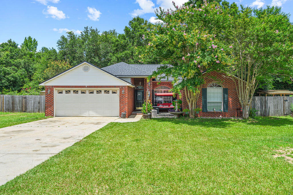 No Backyard Neighbors. 600-Sq.-Ft. Workshop. Brand-New Roof. Discover the perfect combination of privacy, functionality, and peace of mind in this move-in ready 3-bedroom, 2-bath home offering 1,730 square feet of living space on an oversized, fully fenced one-third-acre lot. Tucked away at the quiet end of the neighborhood, the property backs directly to 12 acres of protected city-owned green space, creating a peaceful backdrop for everyday living. The expansive backyard offers abundant room to enjoy the outdoors, while a second separately fenced area is ideal for gardening, pets, a play area, or additional storage.

Inside, you'll find soaring vaulted ceilings, a cozy fireplace, custom bullnose corners, and a spacious, functional layout designed for comfortable everyday living. In addition to the highly desired split floor plan, all bedrooms have generously sized walk-in closets. The kitchen features granite countertops, generous cabinet storage, ample workspace, and a convenient breakfast nook, offering plenty of room for meal preparation and gathering.

In addition to the attached 2-car garage, a feature that's increasingly difficult to find is the detached 600-square-foot steel workshop, complete with a professional-grade 2-post automotive lift. Whether you're a car enthusiast, mechanic, contractor, hobbyist, or simply need secure storage for an RV, boat, trailer, or recreational equipment, this versatile space offers flexibility that's hard to match in today's market. Buy with confidence knowing the major systems have already been addressed, including a brand-new roof (2025), HVAC (2022), and water heater (2021). Kitchens and baths remodeled in 2022.  A current wind mitigation report and active termite bond provide additional peace of mind and may help simplify insurance options.

Conveniently located just 1.5 miles from the hospital, approximately six minutes from the river for boating, fishing, and recreation, and about 30 minutes from the Gulf Coast's beautiful white-sand beaches, this home offers the perfect balance of privacy, convenience, and versatility. From the peaceful setting and expansive outdoor space to the impressive workshop and major system updates, this is a property that truly stands apart.