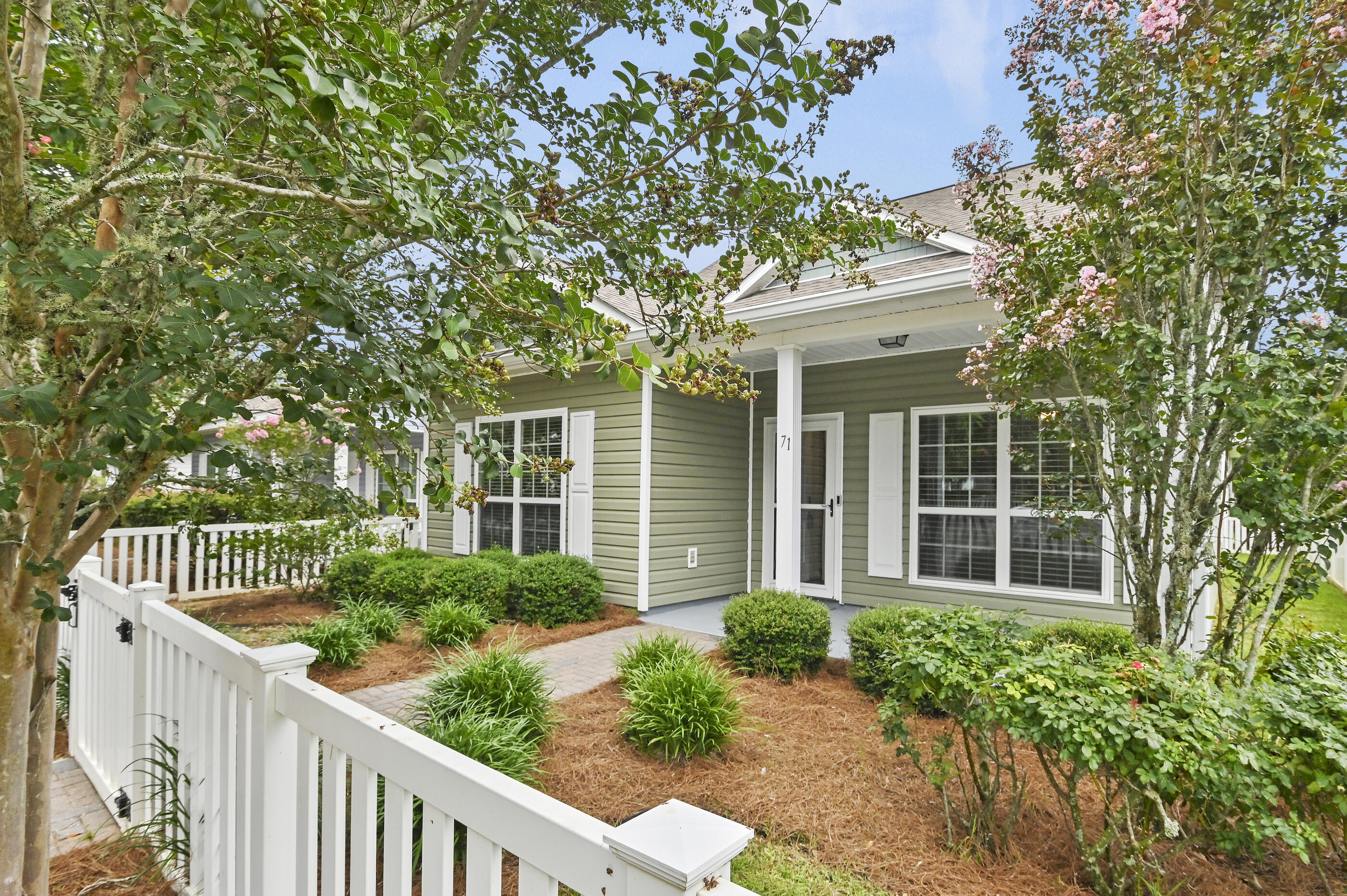 Resort-Style Living Meets Everyday Comfort in Hammock Bay. Welcome to 71 Nelly Street, a beautifully maintained 4-bedroom, 3-bath Craftsman home offering 2,032 square feet of thoughtfully designed living space in the highly desirable Schooner Landing neighborhood of Hammock Bay. From the charming front porch and white picket fence to the spacious open-concept floor plan, this home was designed for both comfortable everyday living and effortless entertaining. The well-appointed kitchen features quartz countertops, a large center island, stainless steel appliances, abundant cabinetry, a pantry, and an upgraded tile backsplash, all opening seamlessly to the living and dining areas. The flexible floor plan offers the convenience of a first-floor primary suite complete with a walk-in closet and private ensuite bath, along with an additional guest bedroom and full bath on the main level. Upstairs, you'll find two generously sized bedrooms connected by a shared bath with double vanities, providing an ideal layout for family and guests alike. Step outside to the screened porch, an inviting retreat perfect for morning coffee, afternoon reading, or relaxing after enjoying the incredible amenities that make Hammock Bay one of Northwest Florida's premier master-planned communities. Since construction, the home has been thoughtfully upgraded with numerous improvements, including quartz countertops throughout, fresh interior paint, a Nest thermostat, gutters, storm door... screened garage door, screened porch with ceiling fan, laundry room cabinetry, updated lighting and plumbing fixtures, enhanced landscaping, and more. Living in Schooner Landing means enjoying one of the most comprehensive amenity packages along the Emerald Coast. Residents have access to multiple resort-style pools, a 25-meter lap pool, a state-of-the-art fitness center, tennis, pickleball and basketball courts, clubhouse, movie theater, dog parks, playgrounds, putting greens, miles of walking and biking trails, stocked fishing ponds, and the private Bay Club featuring a fishing pier and boat dock on Choctawhatchee Bay. Even better, the Schooner Landing HOA includes lawn maintenance, irrigation, fertilization, mulching, and basic cable television, allowing you to spend more time enjoying the community and less time maintaining your property. Located just minutes from the white-sand beaches of South Walton and 30A, Destin, Niceville, Eglin Air Force Base, Hurlburt Field, and Northwest Florida Beaches International Airport, Hammock Bay offers an exceptional combination of convenience, recreation, and community. If you've been waiting for a move-in-ready four-bedroom home in Hammock Bay, this is an opportunity you won't want to miss.