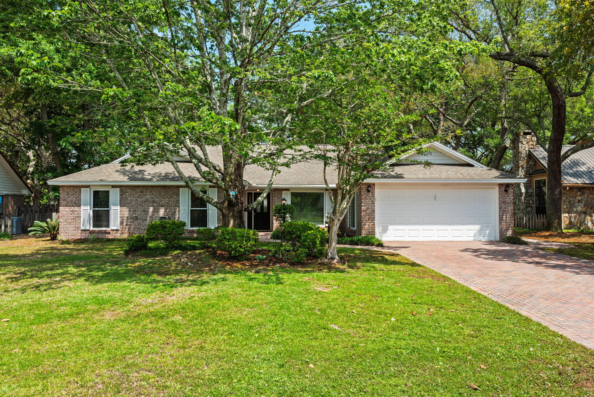the main living spaces and bright tile finishes in the bathrooms. Situated on a generous 0.29-acre lot, the outdoor setting is framed by mature oak trees and lush landscaping, creating exceptional privacy and charm. Enjoy year-round entertaining with a natural gas heated pool, covered patio, expansive paver deck, fenced backyard, and two storage sheds for added convenience.
Extensive renovations completed in 2020 include a new roof and plumbing, along with beautifully updated kitchen and bathrooms, fresh interior paint, upgraded flooring, lighting, vanities, and ceiling fans. New windows were added in 2025. Ductwork was replaced 2023 and pool was resurfaced in 2025.
Residents of Bluewater Bay enjoy access to an array of community amenities including a marina, golf course, tennis courts, walking trails, and playgrounds -- all just minutes away. Contact your agent today for additional details or to schedule a private showing.