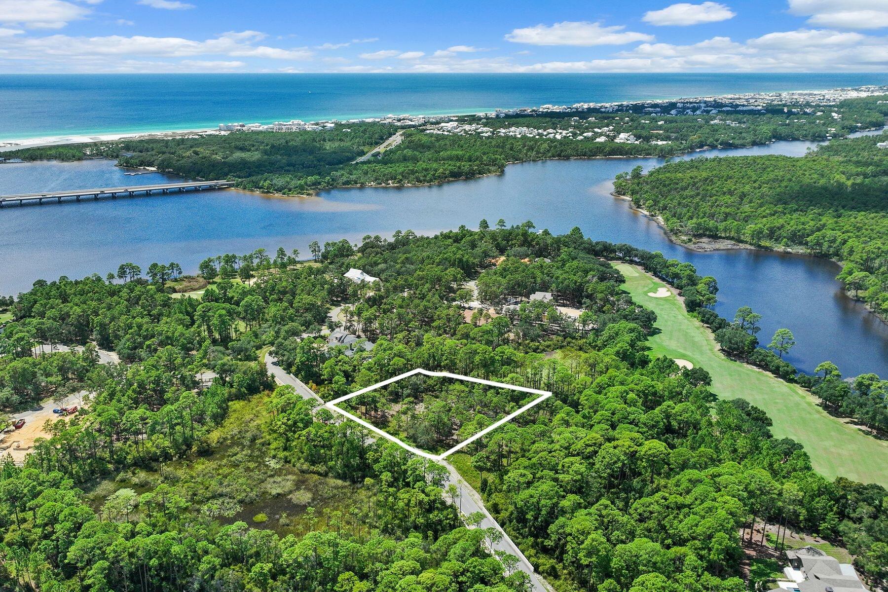 Your 30A lifestyle with room to breathe.

Envision your family enjoying this premium .61-acre homesite and private coastal retreat in the gated community of Wild Heron. With 155+ feet of frontage, this wooded, private homesite offers endless possibilities, backing to green space along the left and rear sides. Located in an X flood zone on a B Lot, with no build-time requirement, you can design and build at your own pace.

Wild Heron continues to attract attention from those who appreciate the coastal lifestyle of 30A, but desire more space, privacy, and value. Just minutes from 30A, Rosemary Beach and Alys Beach, the community offers a more relaxed setting with thoughtfully planned homesites and quality custom-construction standards--without the 30A price premium.

Centered around Lake Powell, the largest coastal dune lake in the country, Wild Heron offers an exceptional collection of amenities. Residents enjoy a lakeside pool and hot tub, lakefront fitness center, fire pit, playground, 24 miles of walking and biking trails, and a private lakefront boathouse and pavilion with fireplace and generous storage for kayaks and other water toys. Launch from the lake for a paddle toward the Gulf's white-sand beaches or Camp Helen State Park. Community gatherings, concerts and movie nights on the green add to the welcoming neighborhood atmosphere, with pet stations throughout the community.
Golf, tennis and clubhouse privileges are available through WaterSound membership. Whether used as a second home or year-round residence, this is an opportunity to create something truly personal and special in one of the areas most distinctive communities--where luxury, space, nature and proximity to the Gulf come together.
Measurements are approximate.  Buyer should verify all data and dimensions.