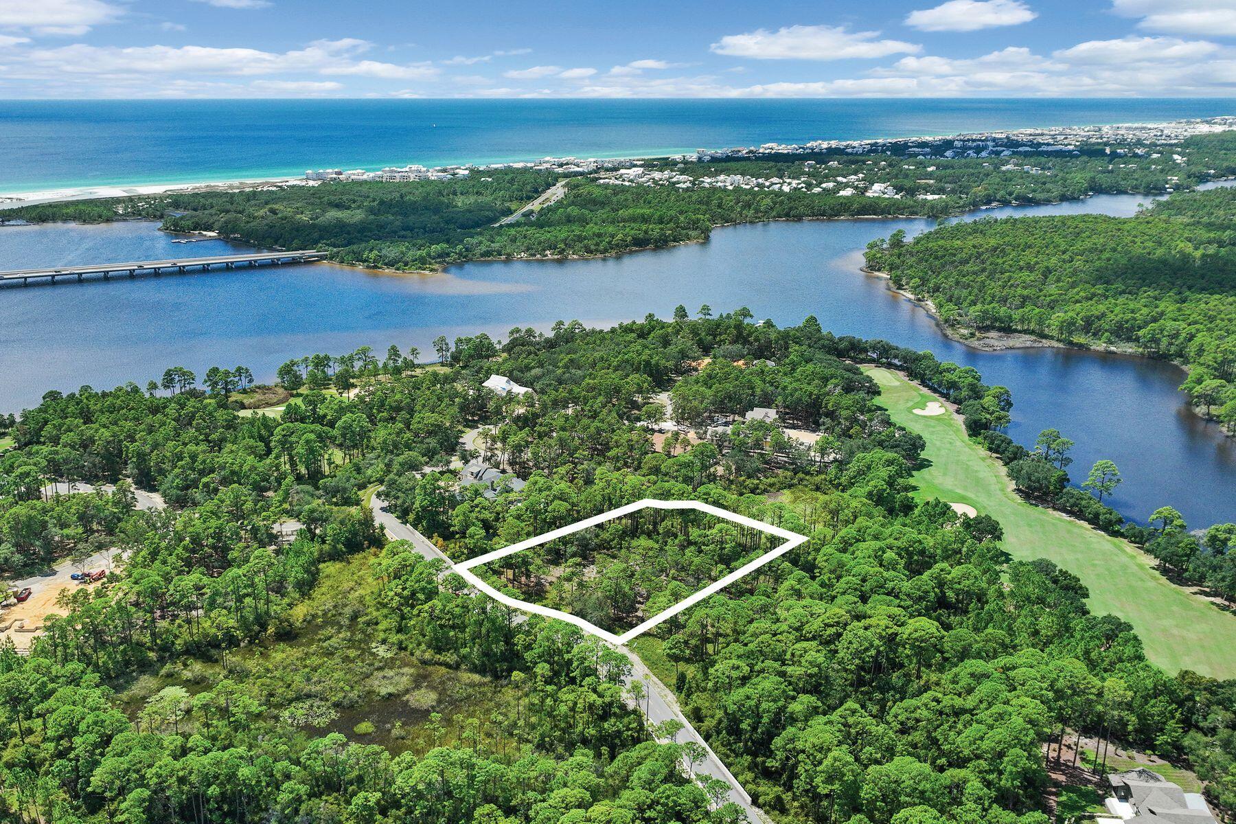 Your 30A lifestyle with room to breathe.

Envision your family enjoying this premium .61-acre homesite and private coastal retreat in the gated community of Wild Heron. With 155+ feet of frontage, this wooded, private homesite offers endless possibilities, backing to green space along the left and rear sides. Located in an X flood zone on a B Lot, with no build-time requirement, you can design and build at your own pace.

Wild Heron continues to attract attention from those who appreciate the coastal lifestyle of 30A, but desire more space, privacy, and value. Just minutes from 30A, Rosemary Beach and Alys Beach, the community offers a more relaxed setting with thoughtfully planned homesites and quality custom-construction standards--without the 30A price premium.

Centered around Lake Powell, the largest coastal dune lake in the country, Wild Heron offers an exceptional collection of amenities. Residents enjoy a lakeside pool and hot tub, lakefront fitness center, fire pit, playground, 24 miles of walking and biking trails, and a private lakefront boathouse and pavilion with fireplace and generous storage for kayaks and other water toys. Launch from the lake for a paddle toward the Gulf's white-sand beaches or Camp Helen State Park. Community gatherings, concerts and movie nights on the green add to the welcoming neighborhood atmosphere, with pet stations throughout the community.
Golf, tennis and clubhouse privileges are available through WaterSound membership. Whether used as a second home or year-round residence, this is an opportunity to create something truly personal and special in one of the areas most distinctive communities--where luxury, space, nature and proximity to the Gulf come together.
Measurements are approximate.  Buyer should verify all data and dimensions.