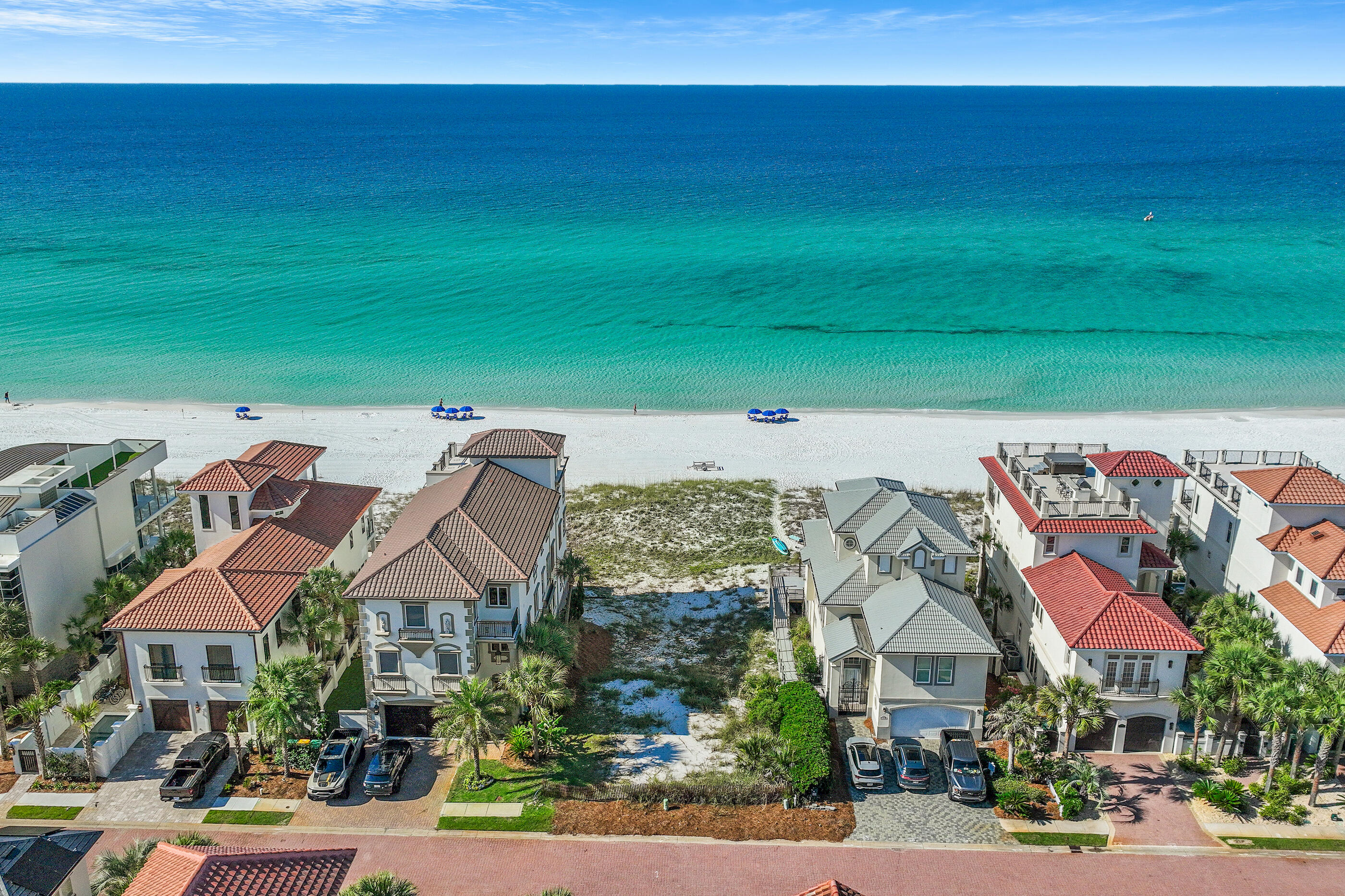 Nestled within the coveted gates of the Destiny by the Sea community you will find a RARE GULF FRONT LOT.  This property offers 50 feet of gulf frontage. Don't miss your chance to build the beach house of your dreams on 1 of 2 remaining Gulf front lots in Destiny by Sea in Destin, located in Northwest Florida. Known as the ''Emerald Coast,'' for its shimmery, glistening turquoise and emerald green waters that meet soft, sugar white sand, this area draws beach lovers seeking privacy and tranquility. This exclusive, gated community is home to Destin's most elite beachfront homes, offering breathtaking views of the Gulf of Mexico and sought after amenities, including a gorgeous clubhouse, expansive neighborhood pool, hot tub, and a fitness facility. This is the lowest priced gulf front lot in Destin on the market!