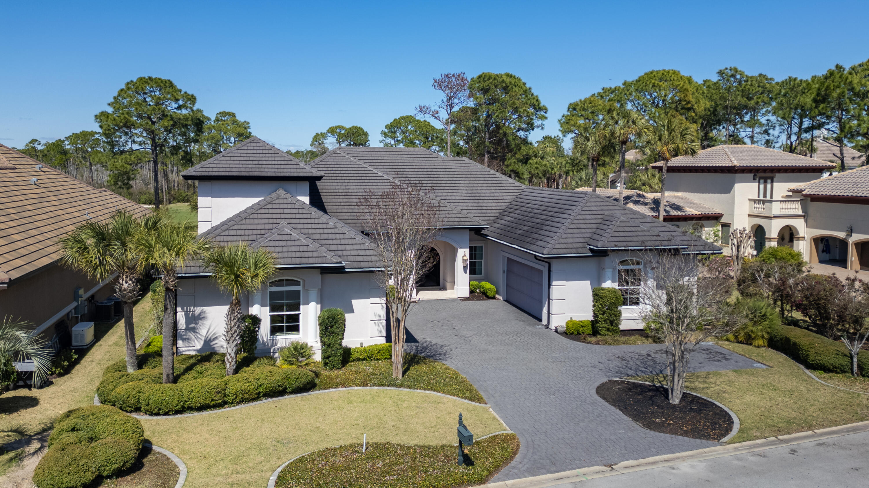 Some homes impress you with a list of features. Others make you imagine what it would feel like to live there.
4575 Sailmaker Lane is the latter.
Custom built in 2018 by renowned Emerald Coast builder Ronnie McGee, this approximately 4,050-square-foot residence
was created as a collaboration between builder and homeowner - not as a spec home, but as a home designed around the
way life would actually unfold inside it.
Walk through the double-arched wrought iron entry doors, and the barrel-vaulted foyer immediately sets the tone. Ahead,
generous rooms, soaring ceilings, architectural beams and custom cabinetry create a sense of scale without sacrificing
warmth. But what becomes most apparent as you move through the home is how naturally one space leads to another.
Imagine friends arriving for dinner and gathering around the wet bar while conversation moves easily between the great
room and kitchen. Someone opens the pocketing glass doors, and suddenly the screened lanai becomes part of the
gathering. Indoors and outdoors no longer feel like separate spaces.
That effortless connection is one of the home's defining qualities.
The kitchen was designed for both serious cooking and everyday life, with a professional-grade Thor six-burner gas range
with griddle, GE Profile refrigerator and Bosch dishwasher. Just beyond is a custom-built pantry that keeps everything
within reach, while a built-in china cabinet provides a beautiful home for stemware and serving pieces. Nearby, the breakfast nook catches the morning light and overlooks the golf course. It is easy to imagine lingering here
over coffee before the day begins.
Or perhaps you never make it to the breakfast nook....
The primary suite has its own entrance to the screened lanai, making a quiet breakfast outdoors an equally tempting way to
start the morning.
Tucked away from the home's gathering spaces, the primary suite was designed as a private retreat with enough room to
create a true sitting area rather than simply accommodate bedroom furniture. Two custom closets provide separate,
thoughtfully designed storage, while dual vanities and an expansive tiled walk-through shower create a bath that feels less
utilitarian and more like a personal wellness retreat.
Privacy continues throughout the bedroom arrangement.
A second ensuite is located down the hall on the main level with its own custom closet, while another ensuite upstairs
creates a peaceful getaway for visiting family or guests. It is removed enough to provide independence, yet still connected
to the home - a thoughtful arrangement for extended stays or multigenerational living.
And then there are the details you begin noticing only after spending time here.
Metallic and textured wall finishes subtly change character as daylight moves through the formal dining room, great room
and primary suite. Crown molding carries from room to room. Custom built-ins feel architectural rather than added. A
private office or den offers a place to close the door and concentrate without giving up valuable living space.

Even the practical elements received the same attention.
The laundry room offers an abundance of built-in cabinetry, turning an everyday necessity into another thoughtfully
organized space. Just beyond it is something unexpected: a separate air-conditioned room ready to adapt to the person who
lives here. Imagine a craft studio, yoga or fitness room, hobby space, or simply additional climate-controlled storage. It is
the kind of flexible space that becomes whatever life requires.
A tankless water heater provides efficiency behind the scenes. A central vacuum system extends throughout the home. An
irrigation system helps maintain the lush landscaping without making it another daily chore. Impact-rated windows and
glass doors and storm-rated garage doors add another level of thoughtful preparation.
Then there are the garages - two separate two-car garages providing four bays in total. Cars, a golf cart, recreational gear
and storage can coexist without competing for space, and each garage has its own attic storage accessed by pull-down
stairs.
Even four-legged family members were considered. An invisible pet fence is already installed in the backyard, providing
another thoughtful convenience for enjoying the outdoor space.
Outside, the screened lanai becomes an extension of the home itself. Pocketing glass doors open the living areas to the
outdoors, while views across the fourth green provide the backdrop. It can be filled with friends one evening and become a
quiet retreat for coffee the next morning.
That may be what this home does best.
It can entertain beautifully without feeling like an entertaining space when the guests leave. It can accommodate family
while still giving everyone privacy. Its rooms are generous, yet there are intimate places to retreat. The architectural
details make a statement, but the floor plan makes everyday life remarkably comfortable.
And because it is within Regatta Bay Golf & Yacht Club, home extends beyond the front door. The community pool, pickleball and tennis courts are approximately a one-minute golf cart ride or a five-minute walk away. When lunch, happy hour or dinner with friends calls, the clubhouse is just a short golf cart ride from home. If boating is on the agenda, Legendary Marina is only 10 minutes from your front door. It is the kind of convenience that makes the neighborhood feel like an extension of your own backyard.
 
4575 Sailmaker Lane was not designed to check boxes.
It was designed to be lived in.
Come walk through it slowly. Open the glass doors. Stand in the kitchen and look toward the great room. Step from the
primary suite onto the lanai. Notice how the spaces connect and how much room there is to gather - and to get away.
Because some homes make far more sense when you experience them than when you simply read about them.
Schedule your private showing of 4575 Sailmaker Lane and discover what custom living in Regatta Bay can feel like.