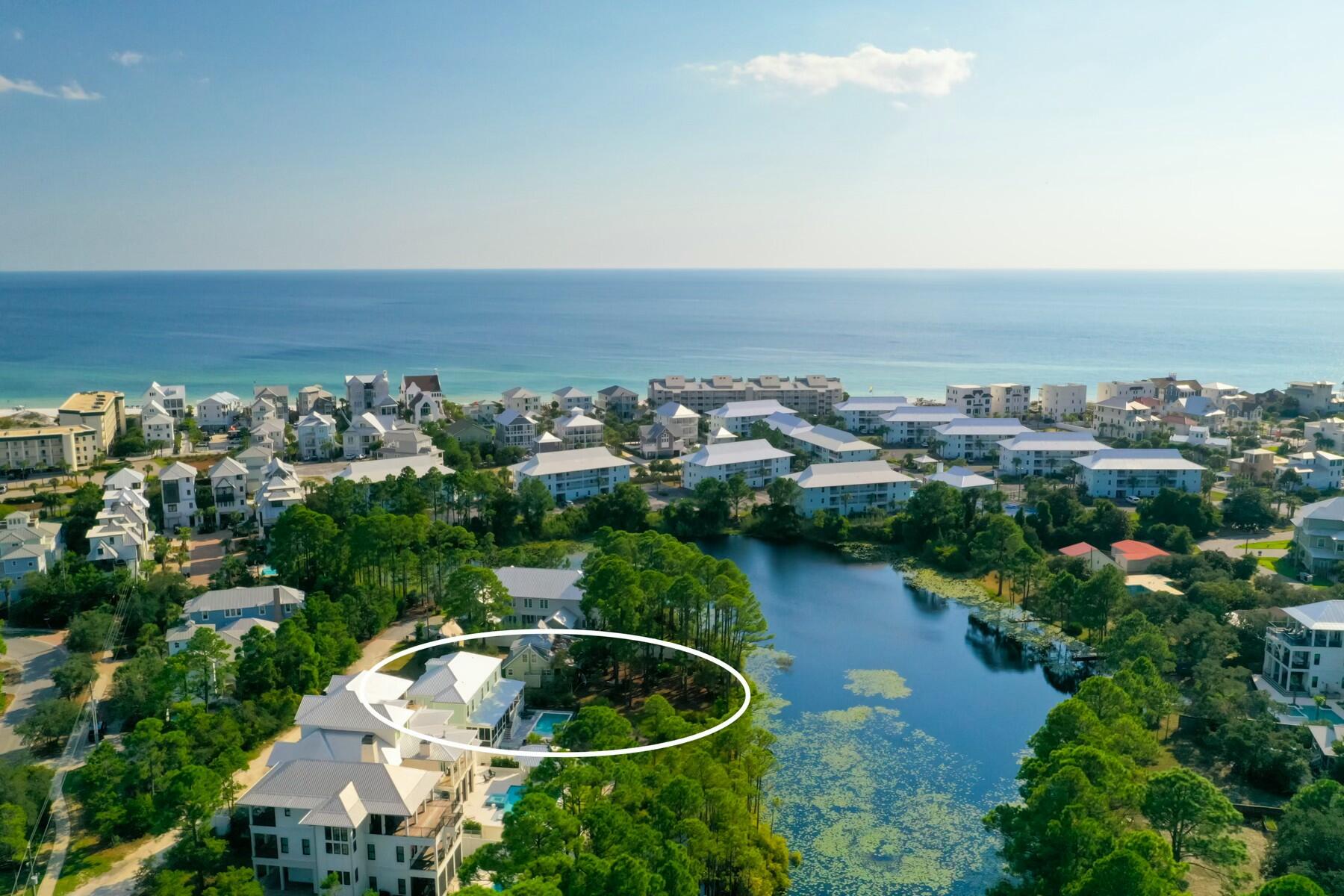 Fresh Opportunity in Seagrove Beach! Welcome to Tucked Away, an exceptional 6-bedroom, 5.5-bath coastal retreat nestled along the peaceful shores of Tresca Lake, just minutes from Walton Dune Beach Access. Offering the perfect blend of luxury, comfort, & investment potential, this beautifully appointed home is ideal as a primary residence, second home, or high-performing vacation rental. Designed for effortless entertaining, the open-concept floor plan features spacious living and dining areas that flow seamlessly into the gourmet kitchen, complete with premium appliances, an oversized island, wine refrigerator, ice maker and abundant gathering space. The thoughtful layout includes a first-floor primary suite, two additional primary suites upstairs, two queen guest bedrooms, a spacious bunk room, 5 bathrooms plus a 1/2 bath providing exceptional comfort for family and guests alike. Step outside to your private lakeside oasis where a heated saltwater pool with sun shelf, covered outdoor living area, gas fire table, expansive porches invite you to relax..enjoy tranquil water views year-round. Situated on a generously sized homesite with parking for six vehicles, this property also features an EV charging station & the rare advantage of no HOA, offering flexibility & convenience seldom found along Scenic Highway 30A. Experience the very best of 30A living!