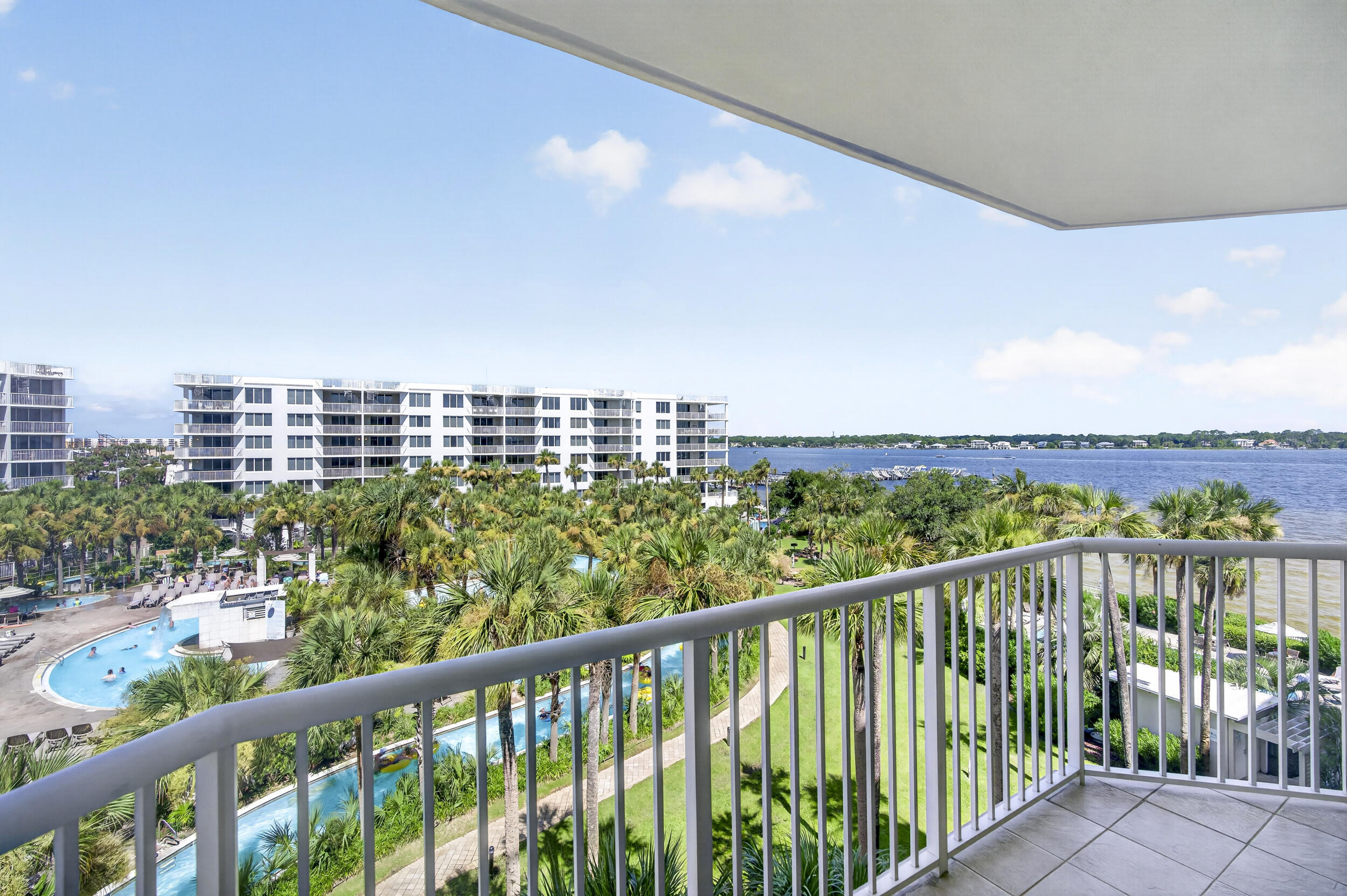 Welcome to Osprey 505 at Destin West Beach & Bay Resort, where your balcony overlooks the famous lazy river and pool complex with sparkling Choctawhatchee Bay views. Sold fully furnished and truly turnkey, this 3BR/2BA condo features a brand-new HVAC (one of two, installed June 2026), freshly painted walls and trim, granite countertops, stainless appliances, and LVP and tile flooring. The primary bath is thoughtfully equipped with safety grab bars at both tub and toilet - a true accessibility feature nearly impossible to find in beach condos, welcoming guests with limited mobility and multi-generational families alike. An established vacation rental with consistent income history, ready to earn from day one. Destin West offers the best of both worlds - Gulfside: 5,000 sq. ft. beachside pool, hot tub, kiddie pool, second heated pool, and fitness center; Bayside: 700-foot lazy river (floats provided!), zero-entry access, heated pool with waterfall, two hot tubs, the Osprey building's own pool, and a bayside dock with boat slips - all linked by a private pedestrian bridge. The new Sunset Isle Yacht Club marina sits just east, with Island Watersports to the west offering pontoon and jet ski rentals for a quick run to famous Crab Island. Walk to The Boardwalk's gulf-front dining, the Gulfarium, and the pier. To the east, miles of protected, undeveloped military shoreline keep the island uncrowded - minutes from Destin without the congestion.