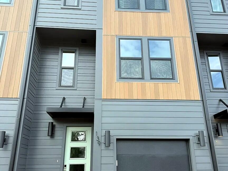 Step inside this striking modern townhome in 30North at Eden Park, where charcoal board-and-batten siding and warm wood-toned accents set a coastal-contemporary tone from the moment you pull into the driveway. Inside, wide-plank wood-look flooring carries you through a bright, open-concept great room with a designer ceiling fan and recessed lighting, flowing seamlessly into a dining area anchored by a live-edge wood table and on into a stunning kitchen: crisp white shaker cabinetry, waterfall-edge quartz countertops, a farmhouse sink, and a full stainless suite with built-in double wall ovens and a sleek vent hood beneath an oversized island made for gathering. Upstairs, four bedrooms offer bright, airy retreats with ceiling fans and generous windows, backed by 3.5 well-appointed bathrooms and the convenience of in-unit laundry. A 1-car garage completes the package. Just north of Hwy 98, you're minutes from the beaches of 30A and the Gulf of Mexico, the moss-draped trails of Eden Gardens State Park, and the upscale dining, boutiques, and galleries of Santa Rosa Beach. Available furnished or unfurnished, with flexible 6- or 12-month terms. Schedule your showing today!