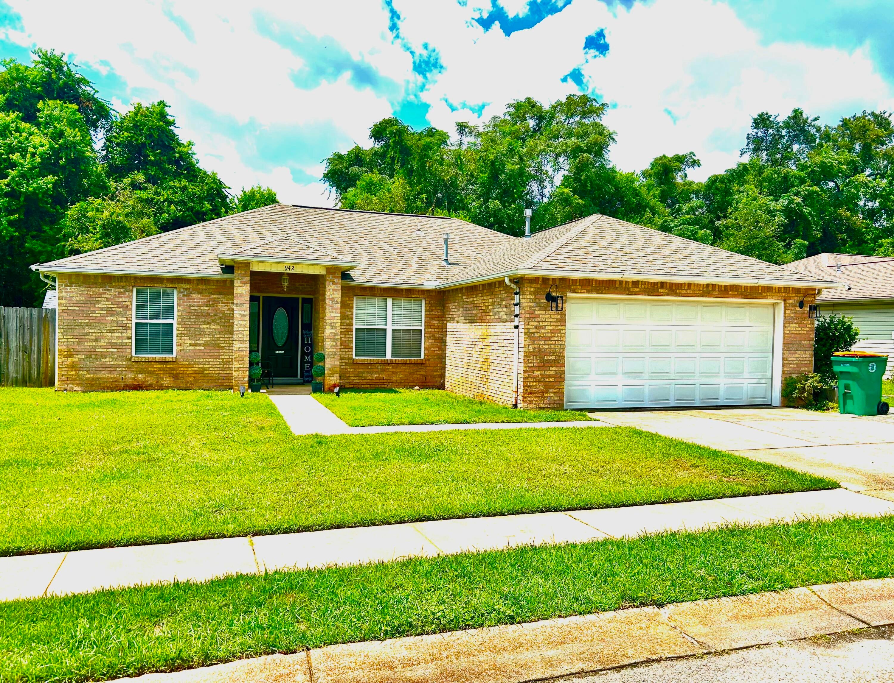 Step inside this beautiful home with many upgrades!! Home is convenient to both bases, close to so many restaurants and shopping, and 15 minutes to the worlds most beautiful beaches! The manicured front yard landscape welcomes you onto the front porch and into a great floor plan - split bedroom layout, with eat-in kitchen and separate front room off the foyer, perfect for dining, office, or cozy added sitting room for reading or entertaining.  Plantation style 2'' blinds, corner fireplace, tray ceilings with crown molding, feature accent lighting in the family room and master bedroom, and new flooring are a few of the nice extra features. The master bedroom has a huge walk-in closet and even has its own door to the back yard. New HVAC 2021, New Roof 2021 and Hot Water Heater also 2021. Outside, enjoy a private backyard! Scenic Oak Lane is a private area tucked away and ready for your next investment property or perfect for a family home!  MOVE IN TODAY!