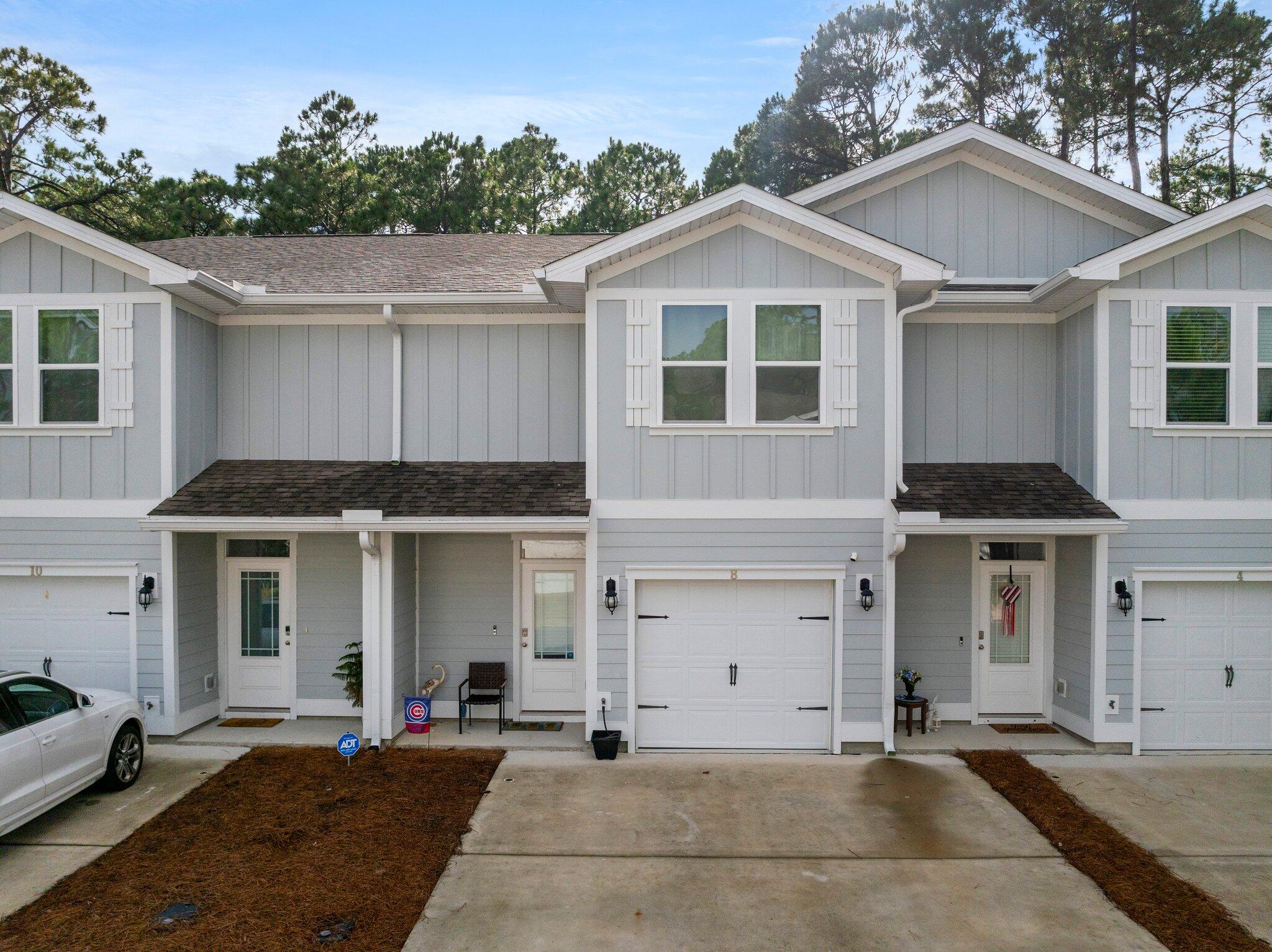 Exceptional Value in Santa Rosa Beach!

Discover the perfect blend of comfort, convenience, and coastal living in the highly desirable Sandhill Pines community. Ideally located just off Mack Bayou, this beautifully maintained townhome is minutes from Grand Boulevard's premier shopping, dining, entertainment, and movie theater.

Nature lovers will appreciate nearby Topsail Hill Preserve State Park, offering miles of pristine white-sand beaches, emerald-green waters, and a more peaceful beach experience than many of Walton County's busier public accesses. The area's popular farmers market and numerous local attractions are also just a short drive away.

Sandhill Pines allows both short-term and long-term rentals, providing excellent flexibility for homeowners and investors alike. HOA fees include exterior insurance, grounds maintenance, trash service, and the master association, valuable benefits that help simplify ownership.

This spacious 3-bedroom, 2.5-bath townhome features durable EVP flooring throughout the main level and comfortable carpeting upstairs, creating a warm and inviting atmosphere in the bedrooms while maintaining an open, coastal-inspired feel downstairs.

The stylish kitchen showcases granite countertops, white shaker-style cabinetry, brushed nickel hardware, and an oversized breakfast bar with ample seating, perfect for entertaining family and friends.

Whether you're searching for a primary residence, second home, or investment opportunity, this property offers an outstanding opportunity to own in one of the Emerald Coast's most sought-after locations.
