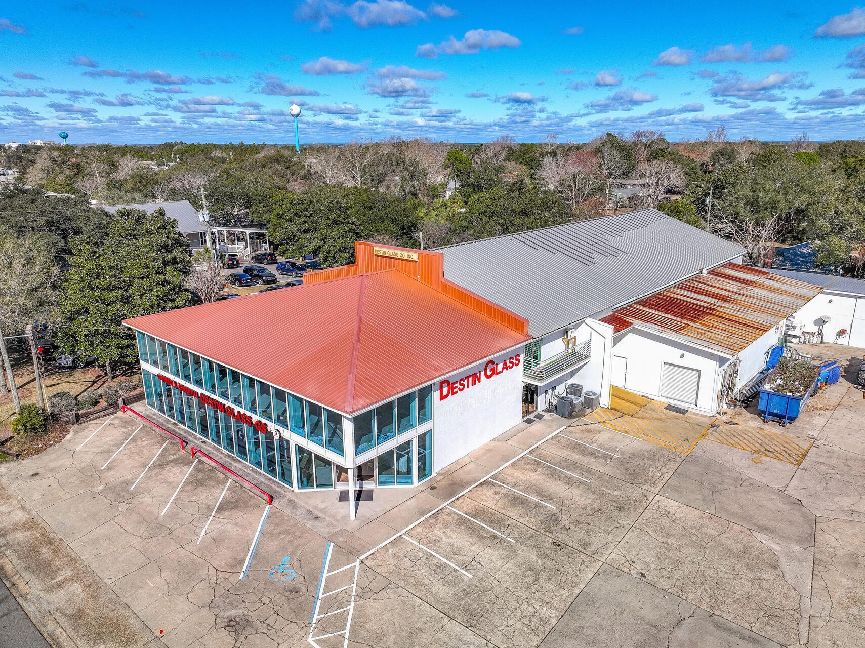 Light Industrial property located on Highway 98 in West Destin.  This 17,000 SF space consist of approximately 5,000 SF office / showroom space along with large free-span warehouse space of roughly 12,000 SF.  The property has 4 roll up doors for its access to the warehouse as well as a 2 story all glass storefront for its showroom and office use.  This property is .68 Acres and can accommodate many different uses.  Traffic counts are 47,500 cars per day (per FDOT 2025).  The property has 27 parking spaces.  Target rent is $12/SF base rent + Taxes & Insurance (estimated at $3/SF)
