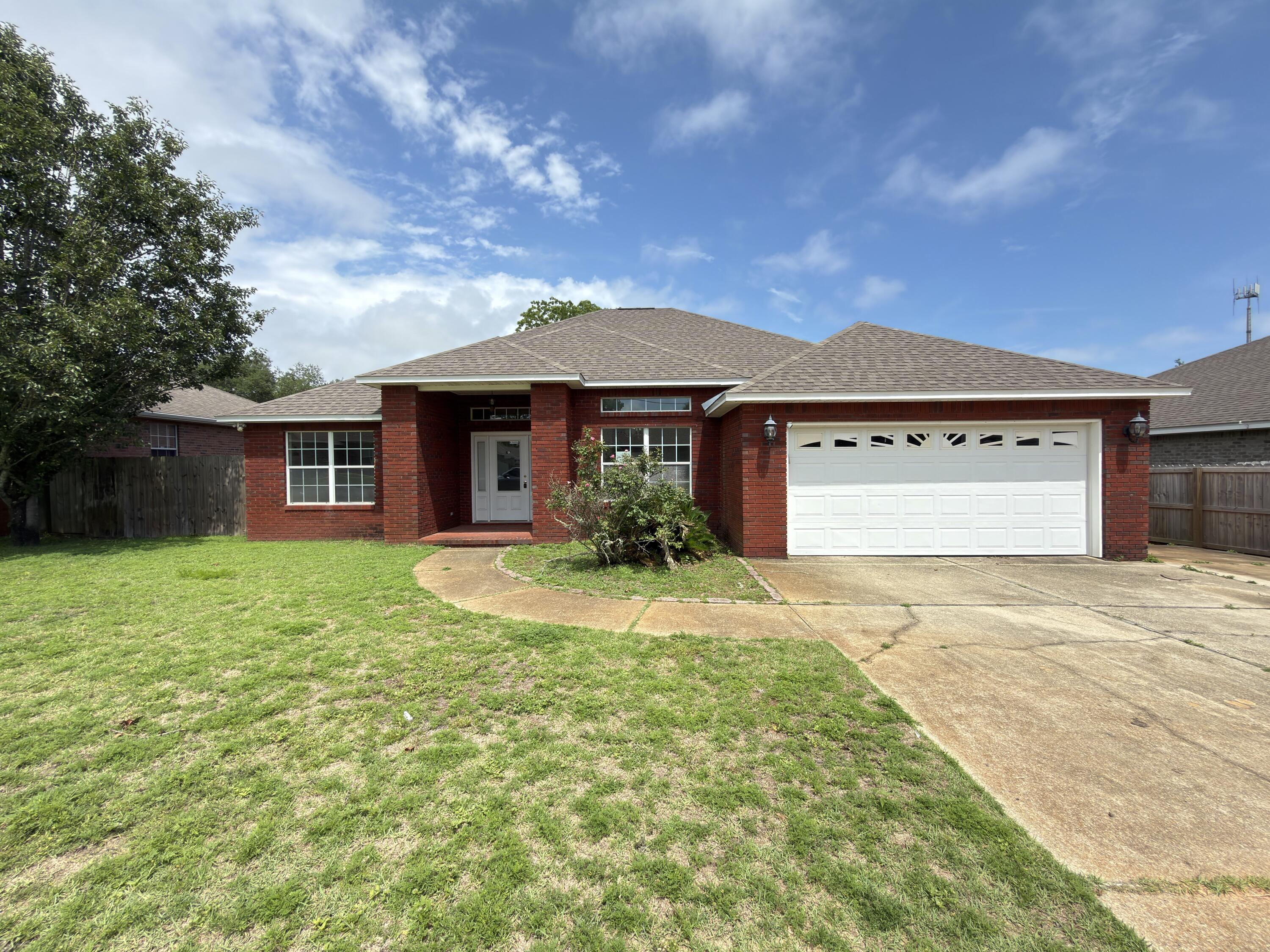 This newest REO opportunity should definitely be on your must see list if searching for a large home with 4 bedrooms, 2 baths, nearly 2000 square feet and less than 3 miles from Hurlburt main gate. Built in 2005, this all brick home has a 2 car garage, privacy fenced back yard, and brick mailbox. Inside you will find a split bedroom design with tiled floors throughout the majority of the home and engineered hardwood covering the rest of the flooring. The great room living room is spacious and inviting with a breakfast nook, granite tops in the kitchen, and a separate dining area. The master bedroom is just off the kitchen and master bath has shower, tub and walk in closet. This home has tons of potential and may qualify for vendee financing, which can be verified on the VRM properties website. Call today!