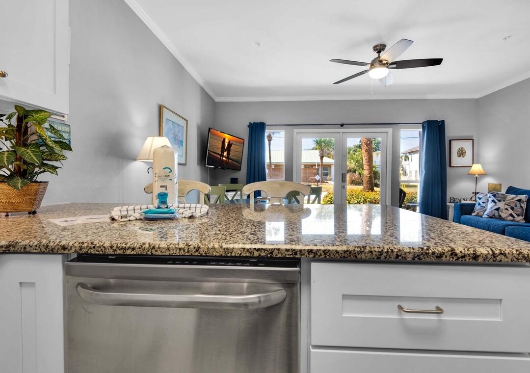 GROUND FLOOR LUXURY IN THE HEART OF DESTIN - JUST STEPS FROM THE WORLD'S MOST BEAUTIFUL BEACHES!

Welcome to your own slice of paradise in the highly sought-after Crystal Beach area of Destin. Located just a short stroll from the sugar-white sands and emerald waters of the Gulf, this beautifully updated ground-floor condominium delivers the perfect blend of coastal elegance, convenience, and investment potential.

Step inside and you'll immediately notice the stunning chef-inspired kitchen, beautifully appointed with endless granite countertops, elegant white shaker cabinetry, a custom designer backsplash, and stainless-steel appliances. Stylish, functional, and designed for entertaining, it's the perfect space to gather with family and friends after a day at the beach.

The open-concept living area is bright, inviting, and thoughtfully designed for effortless coastal living. The spacious primary bedroom provides a relaxing retreat, while hallway bunks and a sleeper sofa allow plenty of room for additional guests. 

Luxury wood-look flooring flows throughout the residence, creating a seamless blend of sophistication and coastal charm. The rich tones and wide-plank design provide the warmth and elegance of natural hardwood while offering the durability and low-maintenance lifestyle today's buyers desire. With no carpet to worry about, the flooring enhances the home's bright, airy feel and perfectly complements the upscale beach-inspired finishes throughout the condominium. One of the most desirable features of this residence is its ground-floor location, offering easy access with no stairs or elevators to navigate. Simply step outside and enjoy everything this charming beach community has to offer.

Caribbean Dunes is a low-density community known for its peaceful atmosphere and exceptional location. Owners and guests enjoy a sparkling community pool, relaxing hot tub, grilling area, and beautifully maintained grounds. Best of all, you're only about 500 yards from the beach--close enough to hear the waves and feel the Gulf breeze.

Conveniently located less than a mile from Destin Commons, you'll enjoy easy access to upscale shopping, dining, entertainment, golf, boating, fishing, and all the attractions that make Destin one of the most sought-after beach destinations in the country.

Whether you're searching for a primary residence, vacation getaway, or income-producing investment, this coastal retreat offers an incredible opportunity to own in one of Destin's most desirable beachside neighborhoods.

Ground-floor convenience. Luxury finishes. Walk-to-the-beach location. Crystal Beach living doesn't get much better than this. Schedule your private showing today.