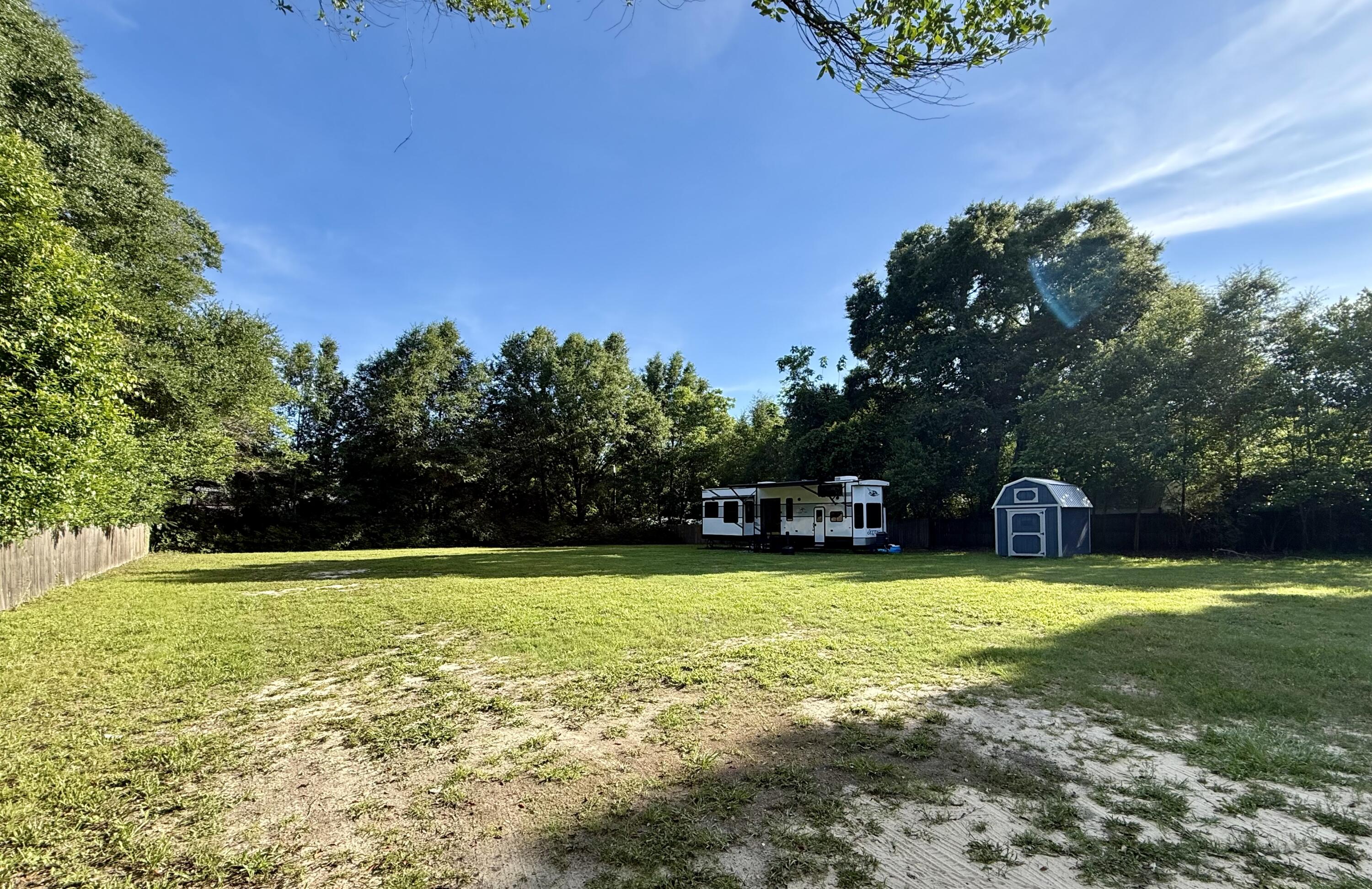 Looking for a private homesite with the convenience of being just minutes from schools, shopping, dining, and major employers? This ready-to-build property offers the perfect combination of privacy and location. The property is enclosed with a privacy fence along the boundary and includes a new 8x12 storage shed. Utilities are already in place with water, septic, and electricity on site, making it easy to start building your dream home. Enjoy the added benefit of lower county taxes while still being close to all the amenities you need. Don't miss this rare opportunity to own a build-ready lot in a desirable location!