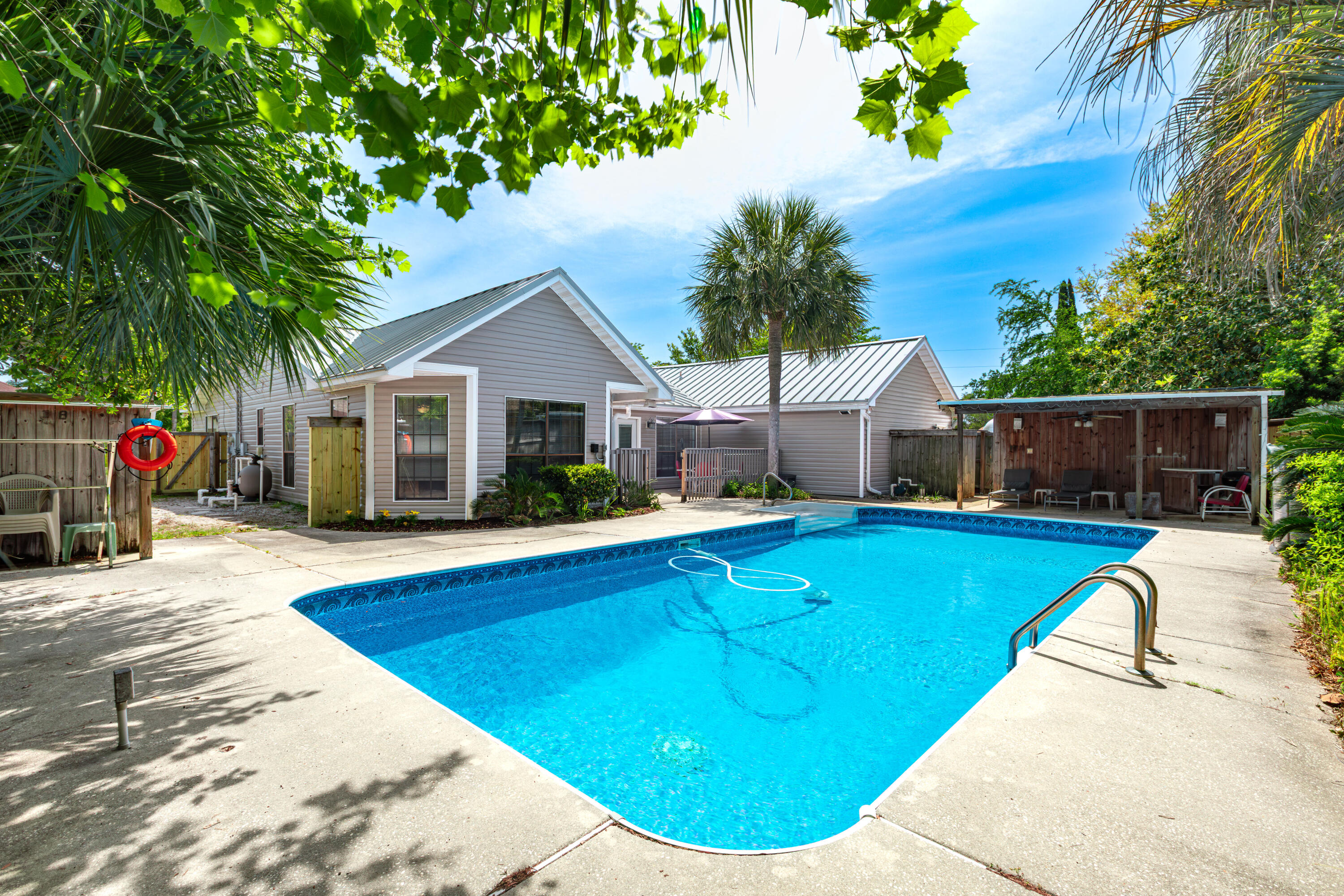 In the well established neighborhood of Kell-Aire Gardens in West Destin we offer for rent 301 Cypress St - 2355 Sq/Ft, 3 bed / 2.5 bath, 2 car garage, corner lot home with an oversized POOL & backyard cabana!  There is plenty of parking for a boat, jet skis, RV or trailers in addition to 4 cars.  ALL Lawn care & Pool maintainence is included.  This is a spacious, well maintained home with a true split floor plan. A large master suite on the opposite side of the house from the two guest bedrooms that share a jack-n-jill bathroom.  The back yard is fully fenced & a safety gate separates the house / patio from the pool. The kitchen / dining area share a double sided fireplace with the huge living room.  This home is in an A+ school district and...ONLY 5 minutes to the BEACH!!  1 year + lease