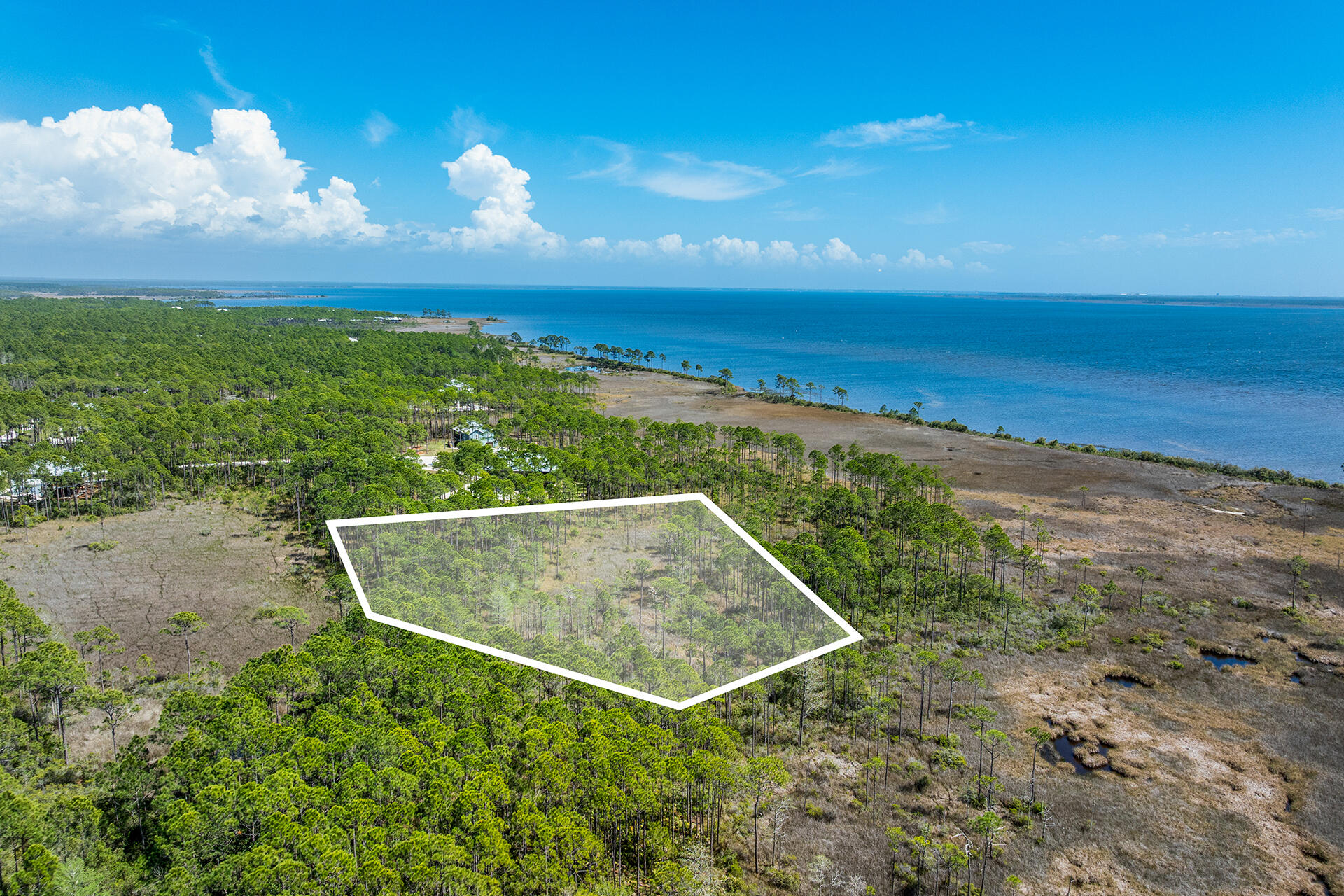 If you have never been out to the St. Joe community, Rivercamps on Crooked Creek, you will be mesmerized! Surrounded by 3 bodies of water, Crooked Creek, the Bay and the Intercoastal Waterway, this peaceful community is a nature enthusiast and boater's dream. 
Plenty of space and privacy and yet so close to all the conveniences one could want; only 15 minutes to the beach or Pier Park with over 100 stores, eateries and entertainment, 10 minutes to the airport and the planned new hospital and Publix also within 10 minutes. Build your dream home on this prime 1.29 acre waterfront end lot with beautiful Bay views. No other homes will be built in front, behind or on the east side. Rivercamps owners and guests enjoy world class amenities not found in any other community.