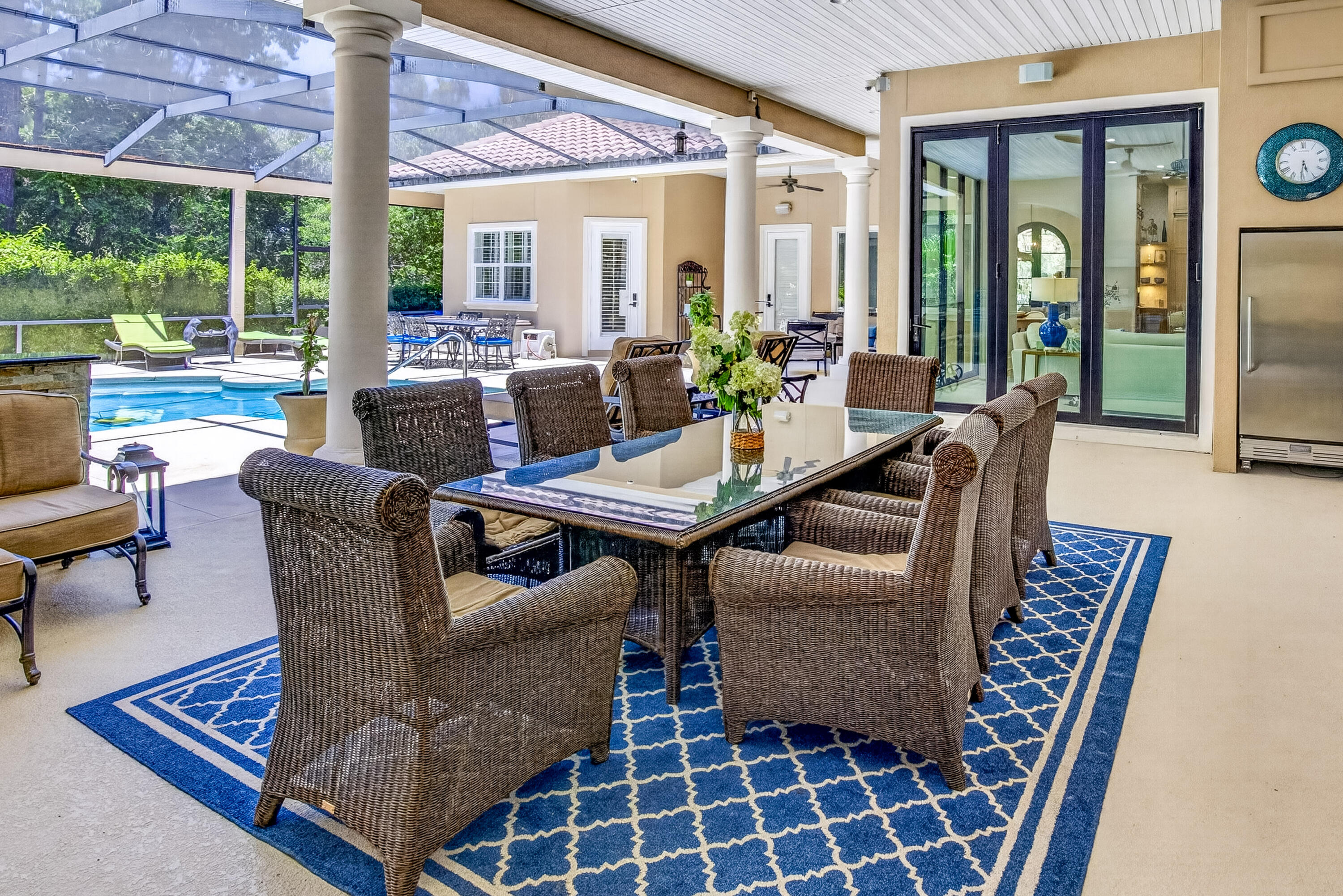 Nestled near the end of a quiet street in the prestigious Pine Valley neighborhood, this exceptional 5-bedroom, 6-bath estate offers 4,475 square feet of impeccably designed living space where timeless elegance meets resort-style Florida living. From the moment you arrive, the impressive paver courtyard, stately columns, and grand entry create an unforgettable first impression. Inside, soaring ceilings, abundant natural light, custom architectural details, and new engineered hardwood flooring complemented by elegant tile throughout create a warm yet sophisticated atmosphere. Designed with both everyday living and grand entertaining in mind, the expansive open floor plan seamlessly connects the formal living room with its striking stone fireplace, elegant dining room, spacious family room, and an extraordinary chef's kitchen. The heart of the home is a culinary masterpiece, thoughtfully appointed with premium Wolf appliances, including a professional gas range and oven, Wolf microwave, Miele built-in coffee system, Sub-Zero wine cooler, and an abundance of custom cabinetry with beautiful glass display cabinets.  Marble countertops, an oversized center island, generous prep space, and a walk-in pantry highlighted by antique French doors complete this stunning space, making it equally suited for intimate family dinners or lavish entertaining. The luxury continues outdoors, where nearly every room opens to an incredible screened tropical retreat designed to rival a five-star resort. With almost as much outdoor living space as the home's interior, this spectacular oasis centers around a sparkling pool and spa surrounded by lush tropical landscaping. The expansive outdoor living room features a fireplace for cool evenings and an impressive outdoor kitchen equipped with a Viking grill, refrigerator, microwave, ice maker, extensive granite prep space, and seating for twelve or more. Whether hosting unforgettable gatherings or enjoying quiet evenings under the stars, this outdoor sanctuary offers year-round enjoyment.

The thoughtfully designed floor plan includes two expansive primary suites, each with private access to the pool and outdoor living area. One luxurious owner's retreat features separate his-and-her walk-in closets and a beautifully updated spa-inspired bathroom designed for ultimate relaxation.

Two additional guest suites each feature private en-suite baths, while a dedicated office provides the perfect work-from-home environment.

Perfect for multigenerational living or extended guests, the attached private apartment adjacent to the garage offers complete independence with its own fully equipped kitchen, living and dining area, walk-in closet, full bath, and washer and dryer--ideal for visitors, in-laws, or a live-in nanny.

Additional recent improvements include two new water heaters, ensuring modern efficiency and peace of mind.

Completing this remarkable property is a spacious three-car garage with dedicated golf cart storage, offering plenty of room for vehicles, recreational equipment, and all the essentials for enjoying the Florida lifestyle.

Perfectly balancing luxury, comfort, and functionality, this extraordinary Pine Valley residence offers an unparalleled living experience where every detail has been carefully curated. From the exquisite chef's kitchen and elegant interiors to the spectacular resort-style outdoor living spaces, this is a home designed to impress and built to be enjoyed.

As an introduction to the Sandestin lifestyle, we invite our new owners to explore amenities that make Sandestin special. The listing brokerage and seller(s) are presenting the buyer(s) of this property with (2) 90-minute rounds of Tennis court time, a golf foursome at one of our three championship courses, and a round of golf for up to four (4) players at the unrivaled Burnt Pine Golf Club.

Sandestin Golf and Beach Resort features more than seven miles of beaches and pristine bay front, four championship golf courses, 15 world-class tennis courts, a 226-slip marina, a fitness center, spa and celebrity chef dining. Shop, dine and play at the charming pedestrian village, The Village of Baytowne Wharf and more. Inside the gates of the resort, residents enjoy a balanced lifestyle of high-class living, spanning the 2,400 acres from the beach to the bay. Everything within the gates of the resort is accessible by golf cart or bicycle. The entire resort is interconnected by miles of pedestrian, bike and golf cart paths that weave through groves of live oaks, meandering past natural lagoons, fountains, man-made lakes, and meticulously landscaped fairways.