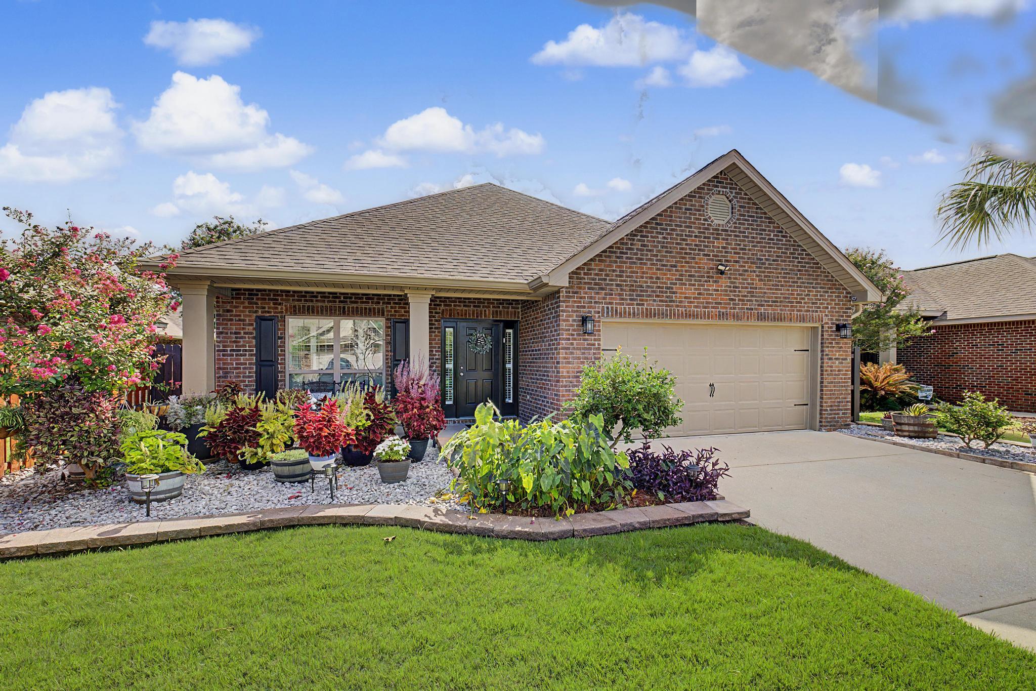 Welcome to this beautifully maintained brick home featuring 3 bedrooms, 2 full bathrooms, and 1,962 square feet of thoughtfully designed living space on a .15-acre lot in the desirable Waterford Sound community. From the moment you arrive, you'll appreciate the inviting curb appeal and attention to detail throughout.

Inside, the open and welcoming floor plan features rounded arch entryways, detailed tray ceilings, and thoughtfully selected finishes. The spacious kitchen is ideal for everyday living and entertaining, offering a center island, elegant quartz countertops, breakfast bar, and dedicated eat-in area that flows seamlessly into the main living space.

The primary living area offers comfort and character with a beautiful trey ceiling accented by wood detailing. A cozy fireplace creates a warm focal point, while integrated surround sound is perfect for movie nights, entertaining, or relaxing at home.

The well-appointed primary suite provides a peaceful retreat, while the additional bedrooms offer flexibility for guests, a home office, or other needs. Two full bathrooms add convenience and functionality.

Step outside to the fully fenced backyard, offering privacy and plenty of room for outdoor activities, pets, gardening, or unwinding. The covered patio extends the living space outdoors and is perfect for morning coffee, weekend gatherings, or relaxing evenings.

Waterford Sound offers a welcoming neighborhood atmosphere with  with community amenities including a neighborhood park and basketball hoops, providing opportunities for recreation and outdoor enjoyment. Community events also create opportunities to connect with neighbors and enjoy the neighborhood year-round. Underground utilities add to the community's convenience and appeal.

With its brick exterior, beautiful architectural details, comfortable living spaces, and inviting outdoor area, this home offers a wonderful blend of style, functionality, and everyday comfort in a community designed for enjoyment
