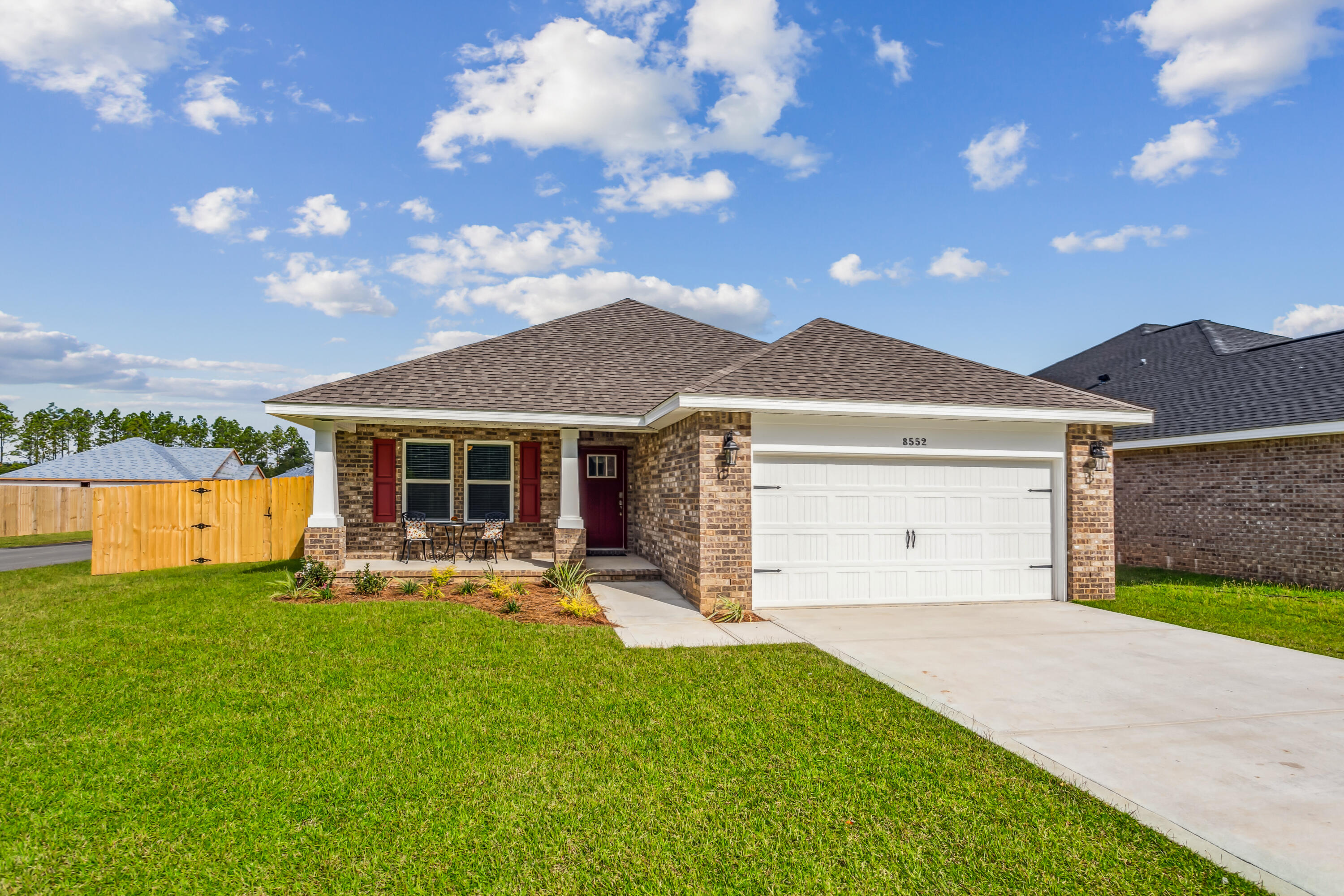 Welcome to the Carlos Floor Plan! This beautifully designed 3-bedroom, 2-bath new construction brick home sits on a .22-acre lot in Holley-Navarre's newest community, Buckeyes Landing. The open layout features vaulted ceilings and a split floor plan, perfect for everyday living and entertaining. The gourmet kitchen includes stainless steel appliances, granite or quartz countertops, soft-close cabinets, under-cabinet lighting, bar seating, and a large pantry. The luxurious master suite offers double vanities, a garden tub, a fully tiled walk-in shower with dual shower heads, and two walk-in closets. Additional features include a whole-house blinds package, brushed nickel hardware, and quality finishes throughout. Pictures and 3D Tour are of Similar Home. Projected completion is October 2026 Listing Brokerage has ownership interest in the property.