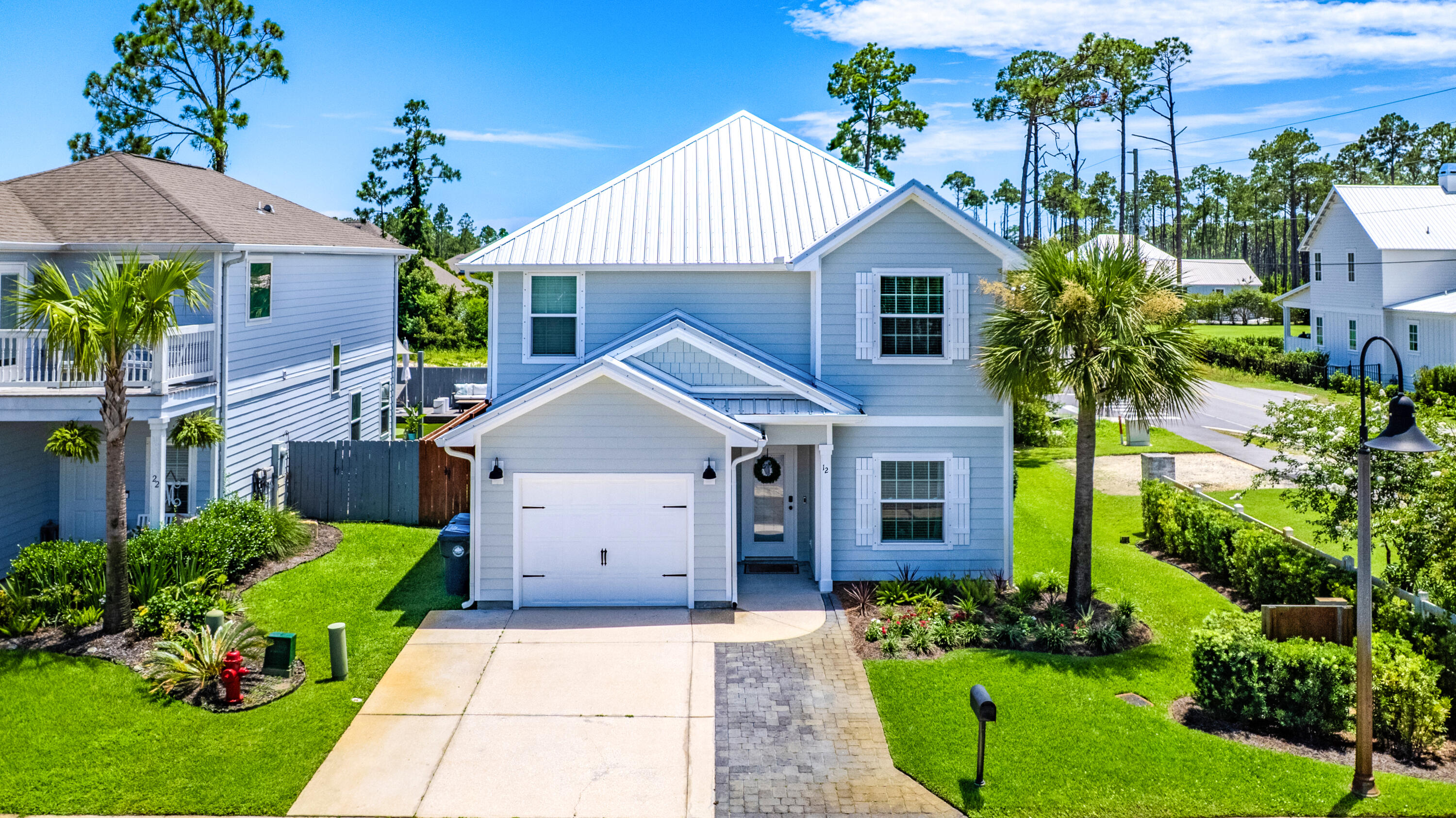 WELCOME TO YOUR 30A BEACH RETREAT!!!  

This beautifully updated beach home offers the perfect blend of coastal style, comfort, and convenience, just minutes from the beach and all that 30A has to offer! 

Featuring 4 bedrooms, 3.5 baths, an open-concept living area, and an upstairs second living space, there's room for everyone to spread out and relax. The upstairs also features a private ensuite bedroom, making it the perfect retreat for guests, teens, or extended family. 

Thoughtful updates include shiplap accents in the entry and primary bath, a shiplap fireplace wall, and updated finishes throughout.

Built with both comfort and efficiency in mind, the home includes a gas tankless water heater, whole home dehumidifier system, and epoxy coated garage floors for added durability and easy maintenance. 

Step outside to your private backyard oasis featuring mature palm trees, a fully fenced in yard, and plenty of space for entertaining. Enjoy morning coffee in your screened in patio for added privacy and Florida charm.

Ideally located on the south side of hwy 98, and less than 2 miles to the beach, you'll be able to enjoy walks and bike rides to 30A, oyster lake, walking trails, Helen McCall park, many coffee shops, restaurants and more. 

Come see for yourself why 12 Woodshire Drive is one of the best values on 30A--you may just find your perfect piece of paradise!