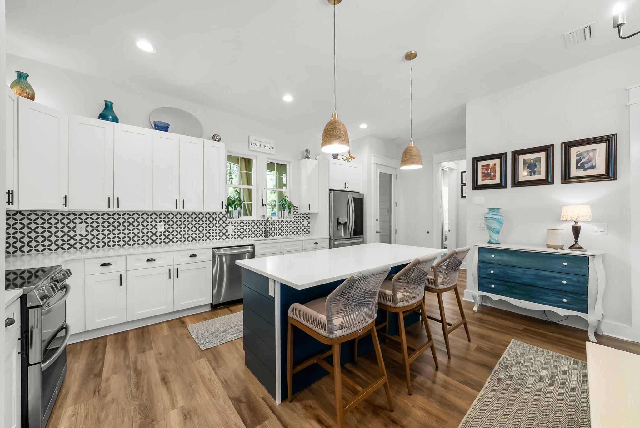 Hidden Grove is a tucked-away residential gem in the heart of Santa Rosa Beach, offering a rare combination of privacy, convenience, and coastal lifestyle. Located just moments from the bay and only a short drive to the sugar-white beaches of 30A, this desirable community places you close to some of the area's best restaurants, boutique shopping, and scenic walking and biking trails perfect for relaxed coastal living. Welcome to 386 Marlberry Trace, a "better than new" home that blends elevated design with everyday comfort. Since acquiring the property three years ago, the owners have invested extensively in upgrades, transforming the home well beyond its original construction. From the moment you step inside, it's clear this is not a builder-grade residence every finish, fixture, and improvement has been intentionally selected with quality and longevity in mind.

The kitchen serves as the heart of the home, featuring an expanded island that provides generous seating and workspace, making it ideal for entertaining and casual gatherings alike. Upgraded appliances, refined finishes, and a functional layout create a space that feels both stylish and practical, seamlessly connecting to the surrounding living areas for effortless flow.

One of the home's standout features is the addition of a spacious screened porch, designed to extend the living space year-round. Complete with an electric fireplace, this inviting retreat offers the perfect setting for morning coffee, evening cocktails, great for barbeques or cozy nights overlooking the peaceful surroundings. It's a true indoor-outdoor living experience that enhances both comfort and lifestyle. In addition, the outdoor living area also serves as a large patio with Astro turf that allows for easy maintenance. Very little traffic passes by as you enjoy your large private backyard with your kids, animals, or family/friends.

Throughout the home, attention to detail is evident from upgraded materials to cohesive design choices that create a warm, polished feel. Whether used as a primary residence, a second home, or a refined coastal retreat, this property offers a rare combination of thoughtful upgrades, privacy, and proximity to everything that makes Santa Rosa Beach so desirable.

Homes in Hidden Grove are seldom available, and opportunities like this where location, craftsmanship, and livability align are increasingly hard to find. 386 Marlberry Trace offers the chance to enjoy the best of coastal living while still feeling tucked away in a quiet, welcoming neighborhood.