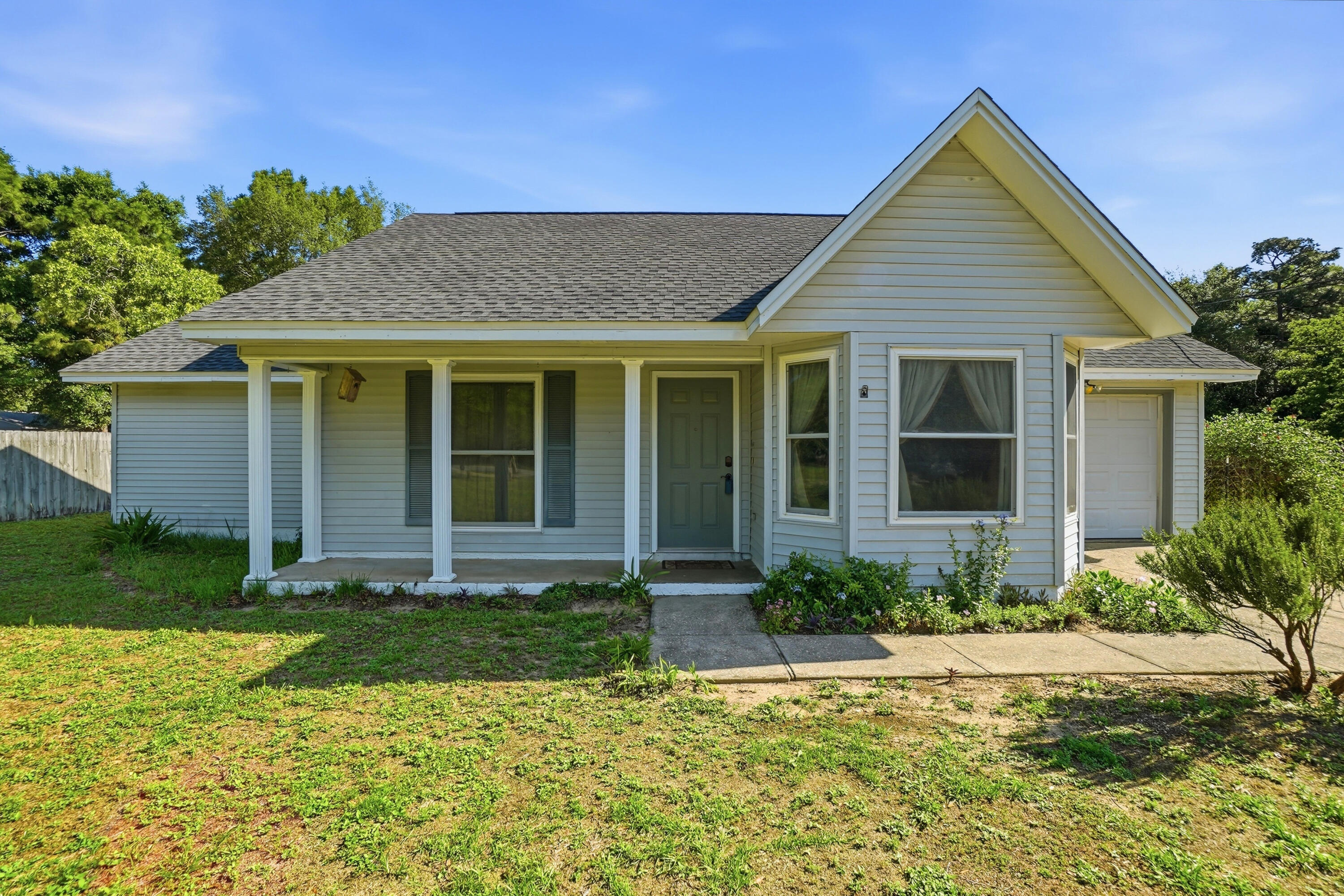 TURN KEY, move in ready and a brand new professional paint job make this gem bright, airy and  perfect for a  new family to make it home!  Located on a spacious half-acre corner lot, this beautifully updated 3-bedroom, 2-bath home at 324 John King Rd offers comfort, durability, and quality upgrades throughout. Major systems have already been taken care of with a new roof and HVAC installed in 2022, plus a water heater replaced in 2021 for added peace of mind.

Built with both style and strength in mind, the home features a 140 MPH wind-load rated garage door, four steel exterior doors, and energy-efficient Pella Thermastar double-hung windows filled with argon gas. Inside, you'll find tile flooring throughout the main living areas and bathrooms, complemented by warm bamboo wood flooring in the primary bedroom. The spacious primary suite also includes a beautifully tiled walk-in shower.

Additional upgrades include solid core interior doors leading to all bedrooms, bathrooms, and the living room closet, providing enhanced privacy and quality craftsmanship throughout the home. With its oversized lot, thoughtful improvements, and move-in ready condition, this Crestview property is one you won't want to miss!