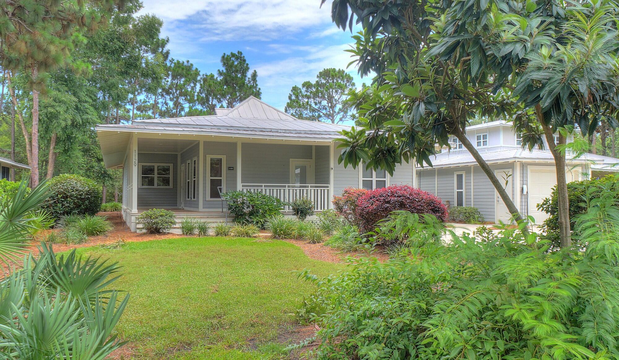 3 large bedrooms in the main house + separate studio with full bathroom!  Don't miss the opportunity to own this beautiful cottage home that sits on the largest lot in much sought-after Prestwick Place!  Enjoy the gorgeous views of the lake from the living room, rear bedroom, roomy screened back porch, or just step out to the newly-refurbished social dock and relax.  Entering from the large covered front porch, step into the freshly painted interior of the main house that offers an elegantly-appointed kitchen with large granite countertops, a spacious living/dining area enhanced with a gas fireplace, and three large bedrooms, each with its adjoining full bath. The front and rear bedrooms also feature private entrances. An additional large bonus room with full bath is located in the freshly-painted interior of the detached studio building, which also provides a handy storage room with an exterior entrance.  Your new cottage has ceiling fans throughout, including 2 brand new fans on the back screened porch. Fiber Internet was just installed in each house in the neighborhood. Prestwick Place is a prestigious Lakeside community located within the world-famous Sandestin Golf and Beach resort.  Sandestin Golf and Beach Resort is a premier 2,400-acre, self-contained destination resort located in Miramar Beach, Florida, just eight miles east of Destin. Spanning from the sugar-white beaches of the Gulf of Mexico to the shores of Choctawhatchee Bay,  this sprawling property operates like a private, gated coastal town.  Sandestin offers four award-winning golf courses, a 113-slip full-service marina, sunset dinner cruises,  and a world-class Tennis Center featuring 15 hard and HydroGrid clay courts alongside dedicated pickleball configurations. There's an abundance of retail & nightlife, with more than 20 restaurants, open-air bars, specialty boutiques, a day spa, and family adventures (like zip-lining) inside Baytowne Wharf.
