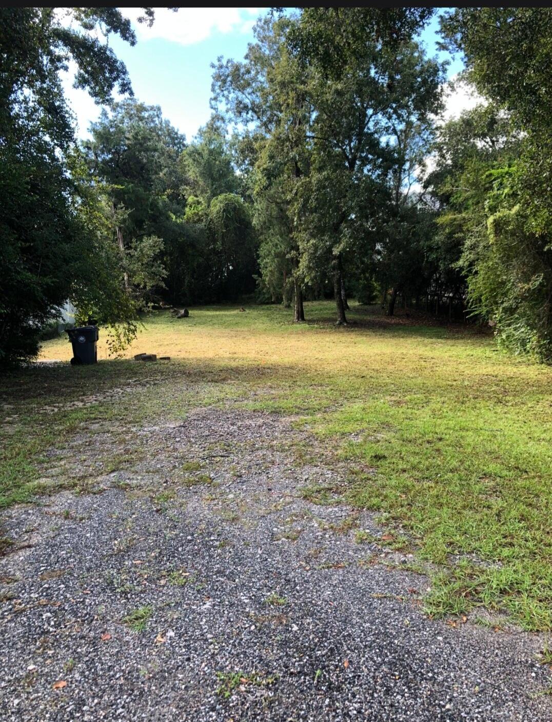 Discover the beauty of true Bay view living on this exceptional lot that offers all the amenities of waterfront life.  Framed by mature hardwood trees that provide natural beauty and shade, this picturesque homesite is ready for your dream coastal retreat. The double lot is situated on Live Oak and Hwy 20.  The property has  improvements already in place, including an existing water meter and septic tank  (needs to be inspected for compliance, not sure of age), helping simplify the building process. With 70 feet of bay frontage, there is excellent potential to build a private dock, providing direct access to some of Northwest Florida's best boating, fishing, paddleboarding, and kayaking. Wake up to breathtaking sunrises over the bay, spend your afternoons cruising to waterfront restaurants, and enjoy unforgettable sunsets from your own backyard.  Located between Niceville and Freeport and just minutes to the mid-bay bridge. Whether you're planning a custom primary residence, vacation home, or investment property, opportunities like this are becoming increasingly rare. Build the waterfront lifestyle you've always imagined at 702 Live Oak Street--where spectacular views, mature trees, and endless recreation come together on the shores of Choctawhatchee Bay.