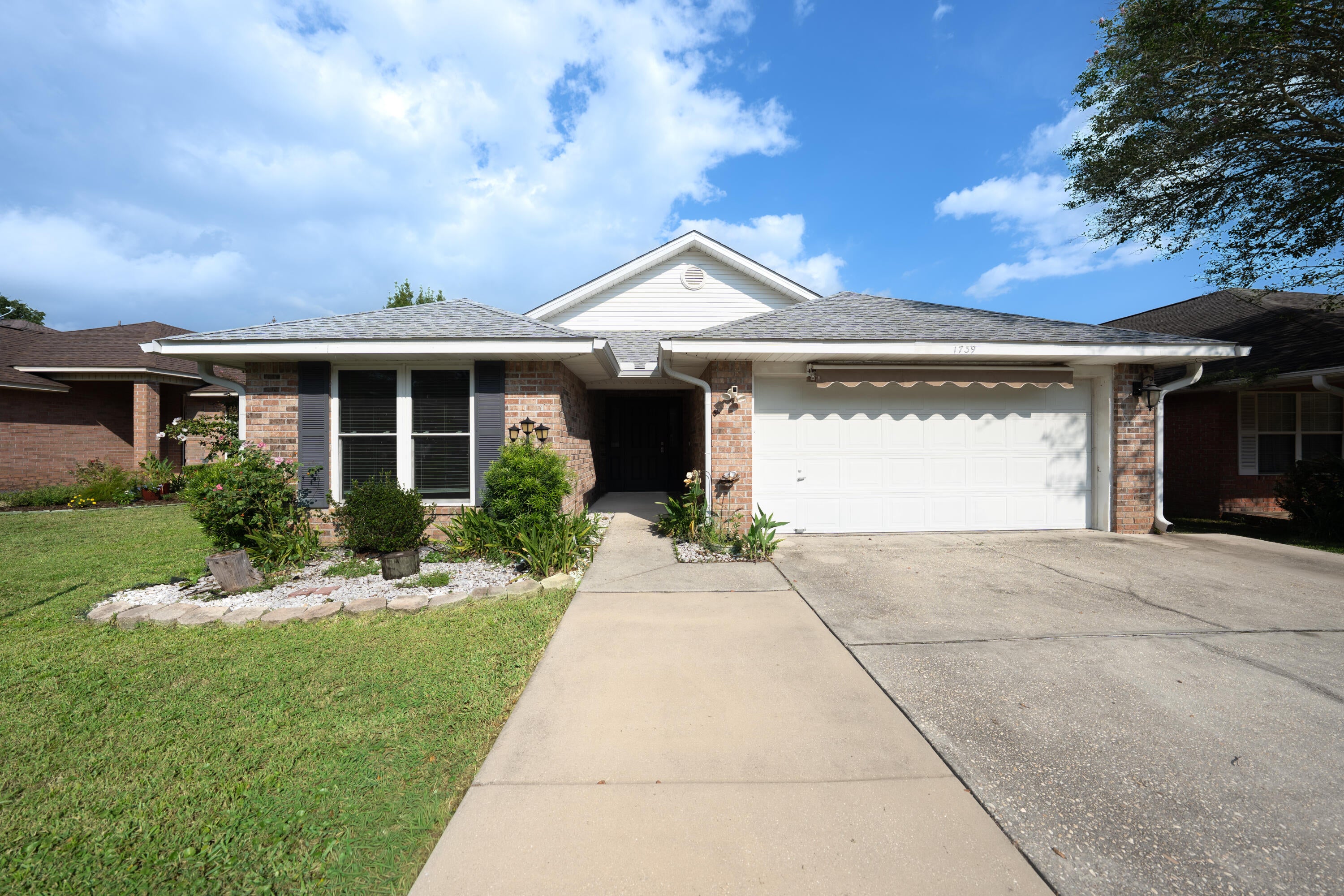 This 2,000-square-foot brick home features wood laminate floors, granite counters, and a tile shower. Major updates include a 2019 HVAC system, 2020 hurricane-impact windows and doors, and a 2021 roof. Exterior features consist of a covered deck and a storage building.  Solid home in move in ready condition.