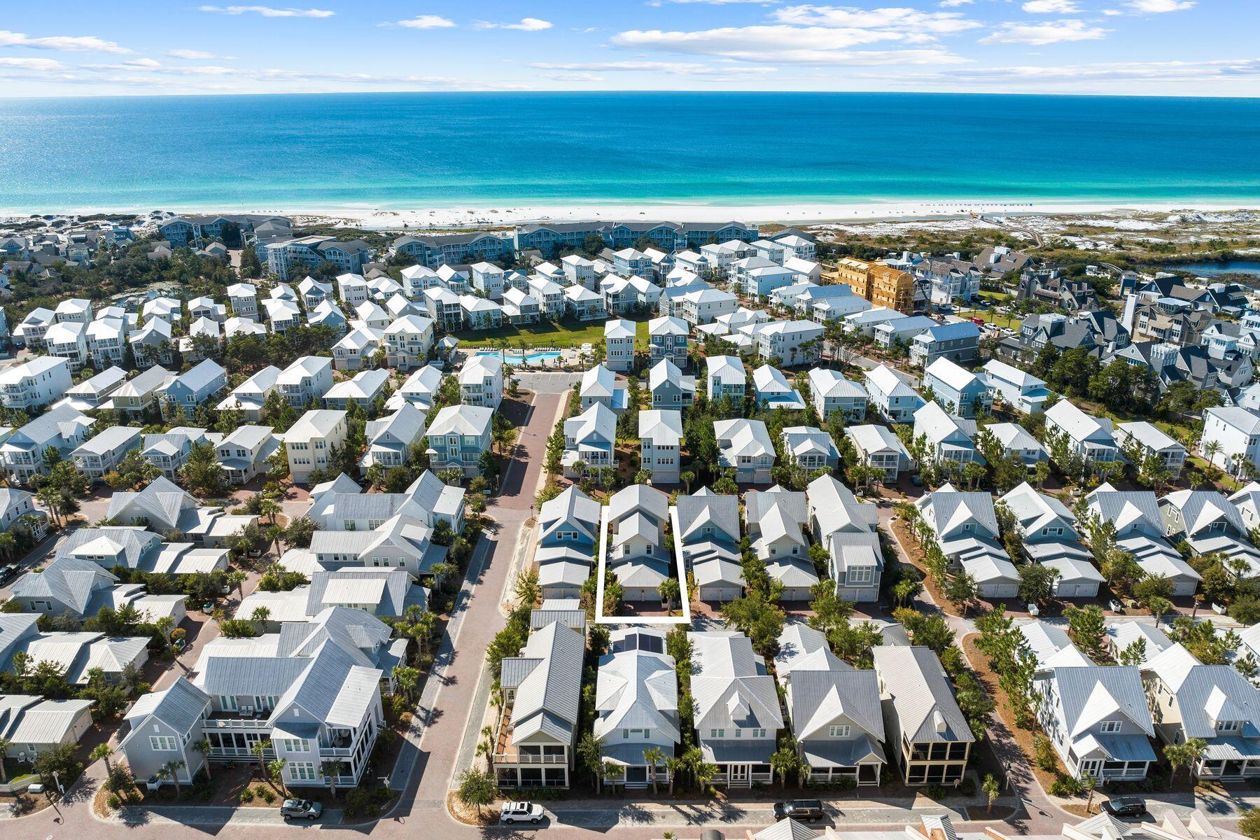South of 30A and just steps from The Big Chill and Prominence's resort-style pool, this fully furnished Somerset floor plan is currently the only one of its kind available, combining projected rental income of up to $150k, a first-floor primary suite, and five-bedroom sleeping capacity in one of the community's most sought-after layouts. Designed for effortless coastal living, the open-concept floor plan features spacious living and dining areas, hardwood flooring, and a well-appointed kitchen that serves as the heart of the home. An oversized front porch extends the living space outdoors, creating the perfect setting for morning coffee, evening cocktails, and gatherings with family and friends after a day at the beach. The first-floor primary suite provides privacy and convenience, while the second level offers three additional bedrooms and a bunk room, allowing the home to comfortably accommodate large families and guests. With four full bathrooms, a powder room, and generous living spaces throughout, this home delivers the sleeping capacity and functionality today's 30A buyers are seeking.  Offered fully furnished and rental-ready, the home also features a two-car garage, a Tesla charging station, a Nest smart thermostat, a tankless water heater, luxury furnishings, and designer window treatments. Prominence owners enjoy access to resort-style amenities, including a zero-entry pool, seasonal beach shuttle service, and direct access to dining, shopping, entertainment, and family-friendly events at The Big Chill. Ideally positioned between Seaside, Florida, and Alys and Rosemary Beaches, 85 Clipper Street offers the convenience, flexibility, and coastal lifestyle that continue to make Prominence one of the most sought-after communities along Scenic Highway 30A.
