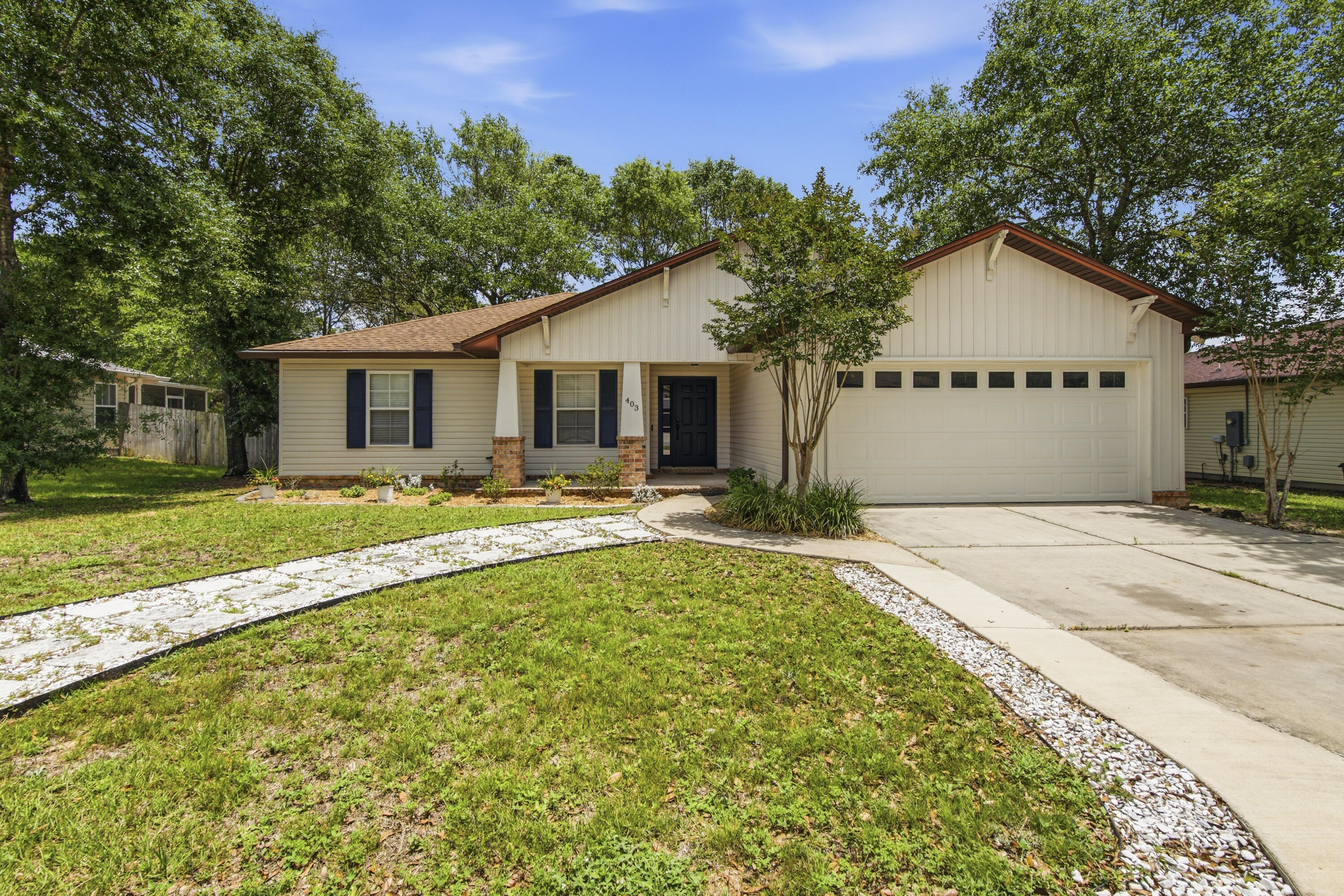Beautifully maintained and move-in ready. This 3-bedroom, 2-bath home in Hunters Ridge offers the perfect blend of comfort and style. The open-concept floor plan features luxury vinyl plank flooring throughout and a newer A/C (2022). The bright, inviting kitchen is filled with natural light and boasts granite countertops, stainless steel appliances, and two pantries, providing exceptional storage. The spacious living area opens through French doors to an expansive deck overlooking a privacy-fenced backyard. The primary suite features a walk-in closet and a private bath with dual vanities and quartz countertops. No pets, trampolines, swimming pools and no vaping/smoking inside the home.