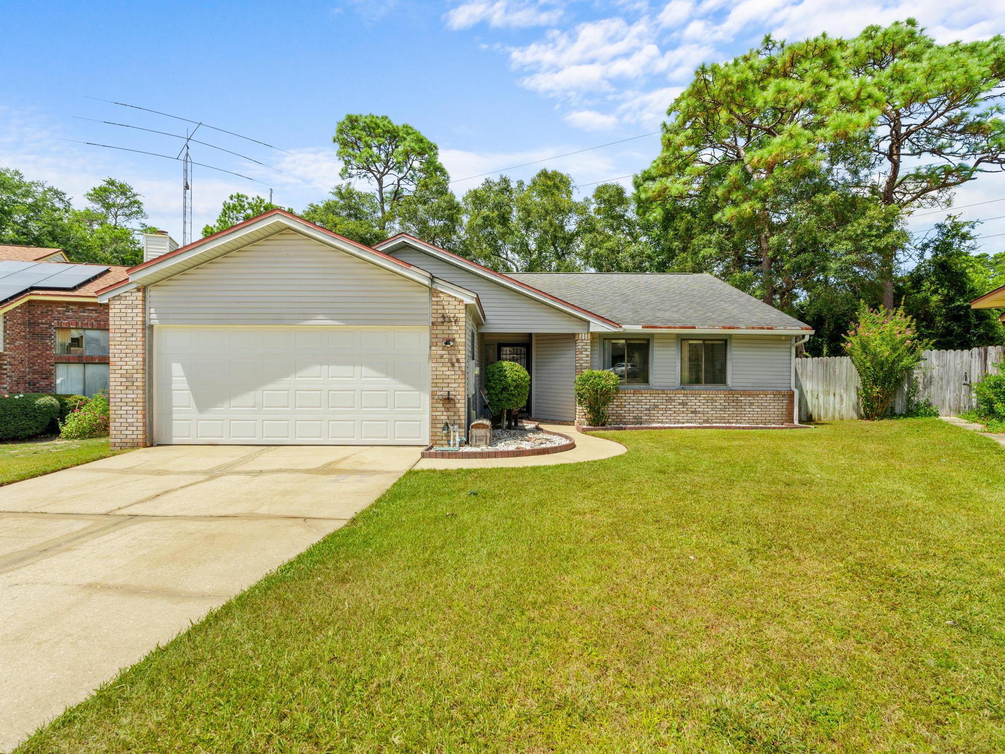 Welcome to this inviting 3-bedroom, 2-bathroom home nestled in one of Niceville's desirable neighborhoods. Offering a spacious layout and wonderful outdoor living, this home is perfect for those seeking comfort, convenience, and room to enjoy the Florida lifestyle.

The well-equipped kitchen features stainless steel appliances and plenty of space for preparing meals and entertaining. The spacious primary suite includes a walk-in closet, providing ample storage and a private retreat at the end of the day.

Step outside to the screened patio overlooking a large backyard, ideal for relaxing, entertaining, or enjoying the outdoors. The backyard also includes a fire pit for cozy evenings under the stars and an outdoor storage shed for lawn equipment, tools, or extra storage.

An oversized garage offers abundant space for vehicles, storage, or hobbies. Conveniently located near top-rated schools, shopping, dining, military bases, and the beautiful Emerald Coast beaches, this well-maintained home is one you won't want to miss. Schedule your showing today!