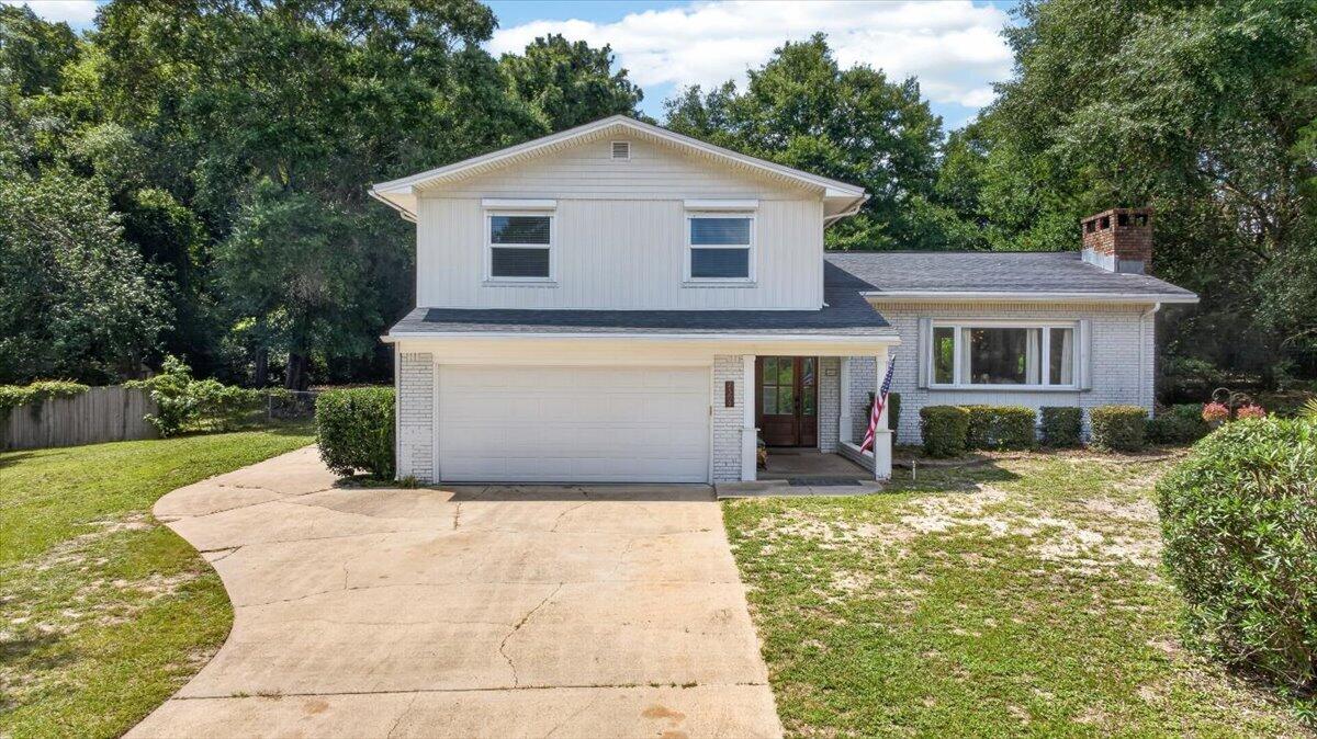 Nestled on a spacious double lot of just over half an acre, this BEAUTIFULLY UPDATED split-level POOL home offers 4 bedrooms, 3 bathrooms, and an attached 2-car garage.

The main floor offers an open floor plan featuring an updated kitchen with a large island, breakfast bar, stainless steel appliances, and abundant countertop space, flowing seamlessly into the dining and living areas, highlighted by a cozy wood-burning fireplace.

Upstairs, the primary suite features a walk-in closet and private en-suite bathroom, while three additional bedrooms and a full bathroom with a double vanity complete the upper level.

The lower level includes a spacious den and full bathroom, offering flexible space for a family room, home office, or playroom. 

Enjoy the backyard retreat with a SPARKLING IN-GROUND POOL and plenty of space to relax or entertain.

Recent updates include newer windows and exterior doors (except one picture window in the living room), newer vinyl siding, two newer HVAC systems (2019), and a new hurricane rated garage door and opener (2024).

Centrally located in Niceville with easy commute to local military bases, shopping, restaurants, and the sugar-white beaches and emerald waters of Destin.