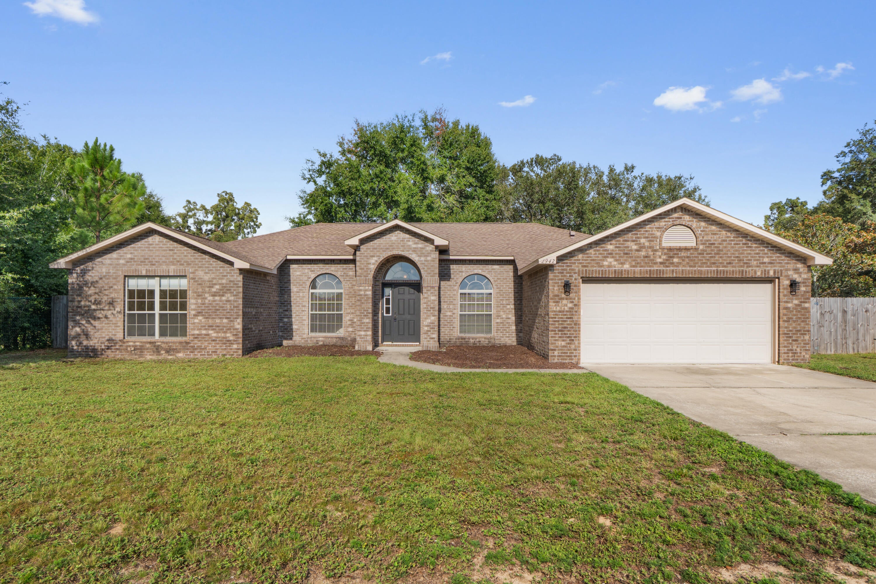 Move-in ready and beautifully updated, this all-brick 4BR + office, 2,095 sq ft home sits in the quiet La Mesa at Hidden Creek community -- just minutes from Navarre Beach, local parks, and everyday conveniences. A new roof (2024) and HVAC (2024) add peace of mind from day one.

Inside, the home delivers a bright, open layout with a formal dining room, dedicated office, and a spacious family room that flows to a 12' x 20' covered porch through double French doors. The kitchen is designed for gathering, featuring custom bullnose granite, a hop-up bar, island, eat-in breakfast area, and premium staggered cabinetry with stainless steel Whirlpool appliances.

The split-bedroom design offers privacy, while the large covered porch creates an easy indoor-outdoor living space. Hidden Creek Golf Club is nearby, adding to the neighborhood's appeal without being front-and-center.