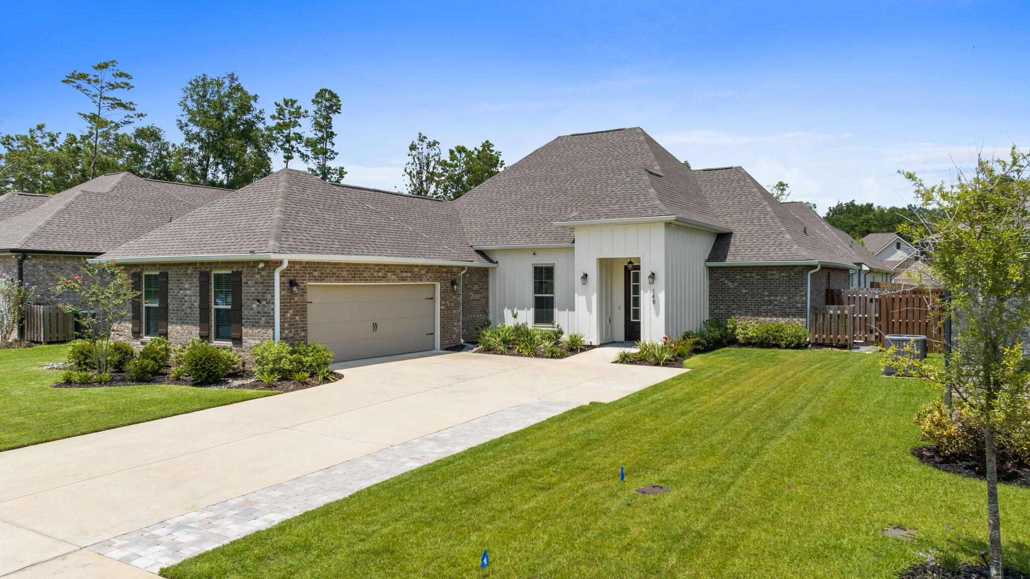 The CLAUDET III G in the Wildflower neighborhood of Hammock Bay offers a 4 bed, 3 bath, open design with formal dining room and keeping room. Seller has added so many upgrades to this pet free and smoke free home.
Features: double vanity, garden tub, separate custom tiled shower, and 2 walk-in closets in master bath, tray ceiling in master bed, kitchen island, walk-in pantry, boot bench/drop zone in mudroom, covered rear patio, additional paver patio, recessed lighting, crown molding, smart connect Wi-Fi thermostat, smoke/carbon monoxide detectors, landscaping package, architectural 30-year shingles, flood lights, and more!
Energy Efficient Features: water heater, kitchen appliance package, and more! Energy Star Partner. 
Seller added Upgrades:
Natural Gas plumbed for a generator.
GE Cafe Appliances w/natural gas range.
Natural gas tankless water heater.
Whole home water treatment system.
Reverse Osmosis water system.
Ecobee thermostat.
Remote control ceiling fans in Living and MBDR.
Light fixtures in Dining Room and hallways.
Kohler toilets in all bathrooms.
Paver driveway expansion. Paver patio.
Epoxy Garage floor coating.
Garage overhead storage racks.
Whole home Gutters
Water treatment system on outdoor irrigation system to prevent iron stains. Fenced yard
Podocarpus shrubs to add privacy in the backyard.
Hammock Bay amenities include:
3 clubhouses, 5 pools, fitness centers, bayfront w/dock, sports complex, General Store, Props Brewery, miles of sidewalks, dog parks and m