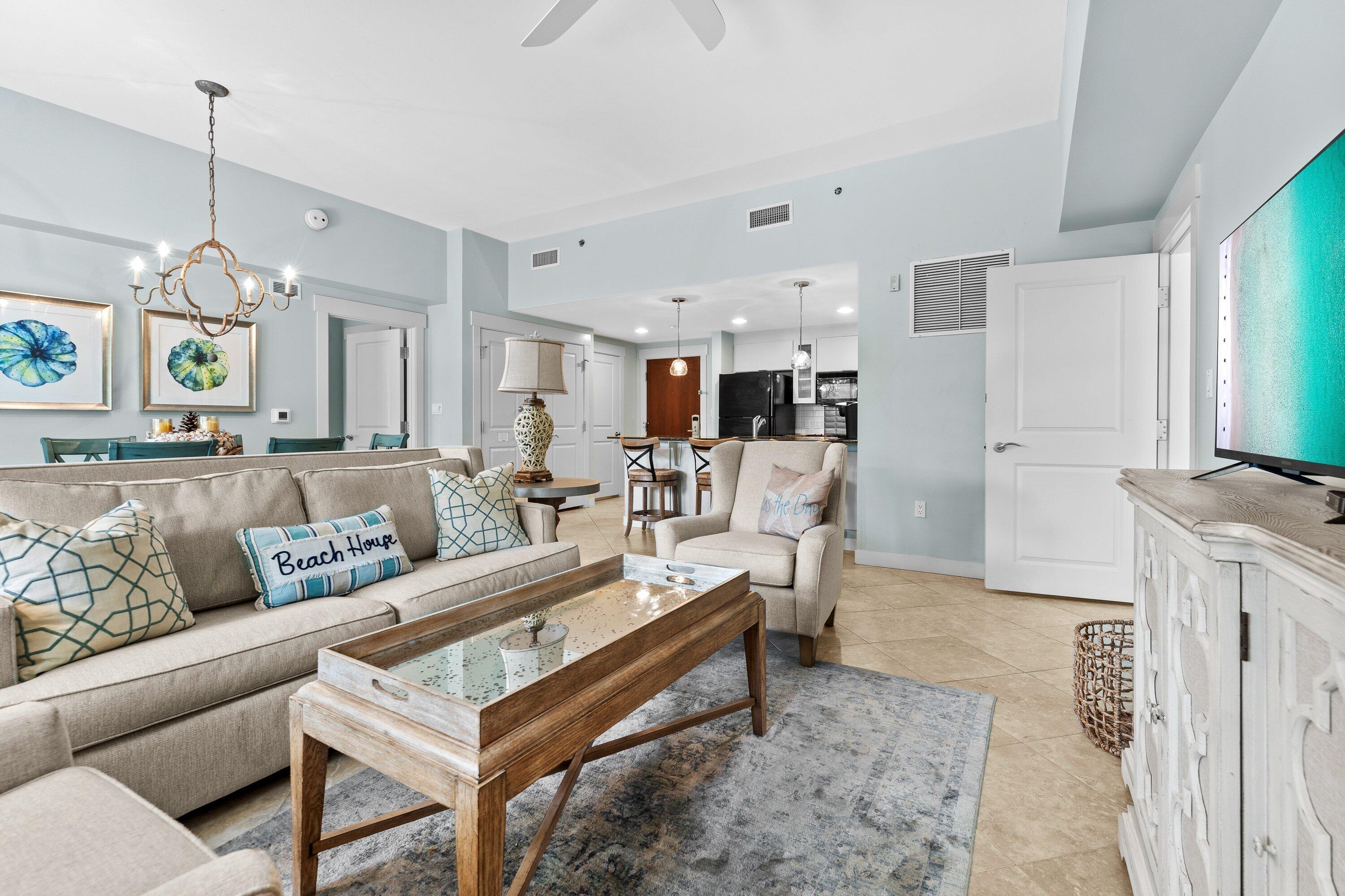 Embrace an easy coastal lifestyle with bayfront charm and built-in flexibility in this beautifully designed ground-floor 2-bedroom, 3-bath condominium, ideally positioned just a short walk from the shops, dining, and entertainment of Baytowne Wharf, with views of the Choctawhatchee Bay.

Featuring a versatile lockout floor plan, this residence offers the ability to function as a spacious 2-bedroom retreat or be separated into a 1-bedroom unit and studio, creating endless possibilities for personal use, guest accommodations, or maximizing rental potential.

Step outside onto your private covered patio and enjoy peaceful bay breezes with convenient walkout access to the lawn area. Whether you're starting the morning with coffee, winding down after a day at the beach, or heading out to explore the resort grounds, the outdoor space adds another layer of relaxed coastal living.

Inside, the thoughtfully designed interior combines modern finishes with a clean coastal feel, creating an inviting space that's equally suited for everyday comfort and entertaining.

Owners and guests enjoy access to Bahia's beautifully maintained Grand Gardens and resort-style pool, while the Village of Baytowne Wharf is just steps away, offering boutique shopping, restaurants, galleries, nightlife, and year-round events.

Whether you're looking for a full-time residence, a vacation getaway, or an investment property with flexibility built in, this condo offers an ideal combination of location, lifestyle, and function in one of the area's most sought-after resort communities. It's designed to fit the way people want to live, vacation, and invest along the Emerald Coast.