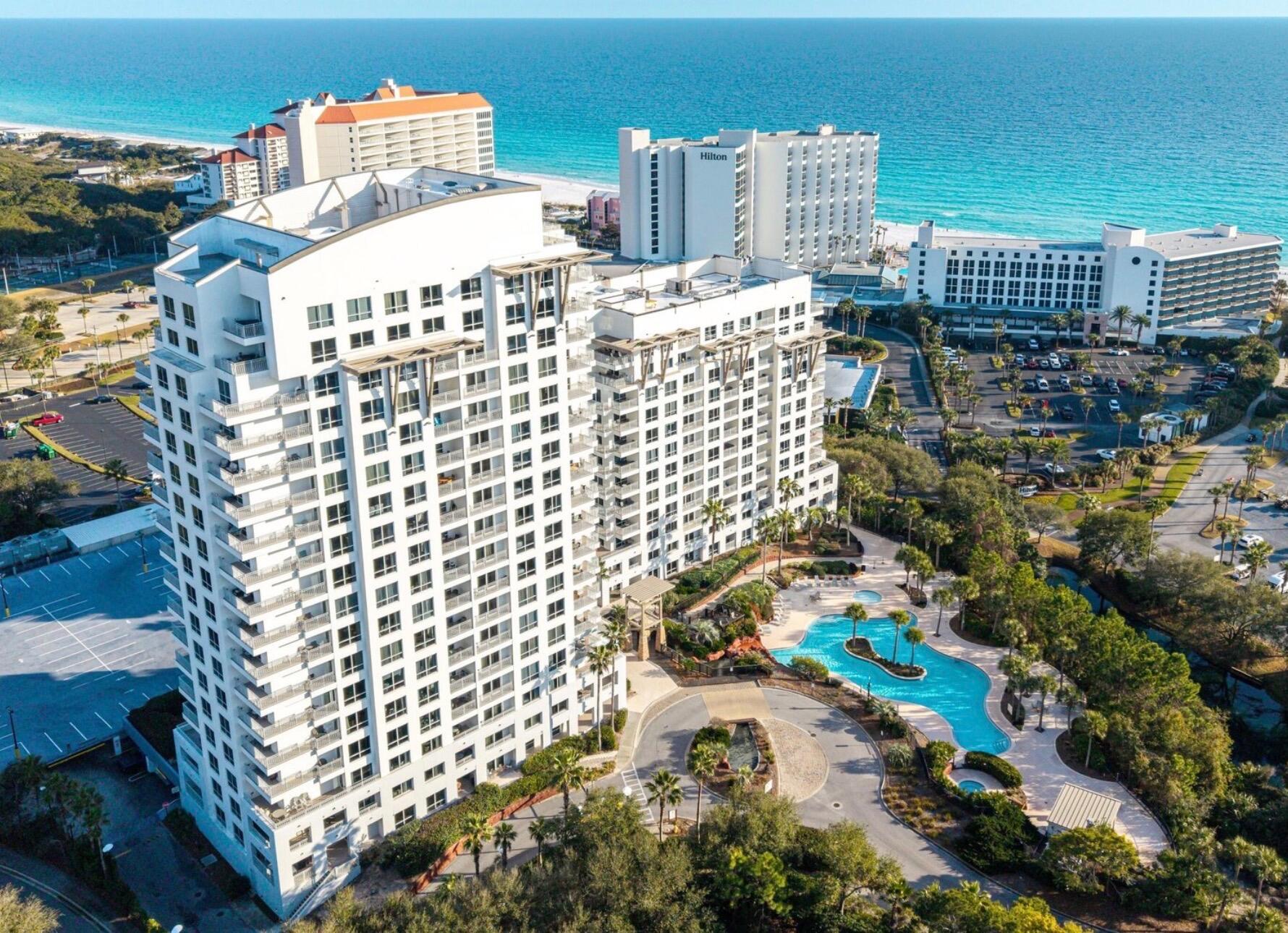 Closest to the Beach, so Short Walk! Elevated first-floor living--no elevator wait times during peak seasons--offers quick, easy access to the pool, fitness center, and main entrance. Designer-decorated and beautifully updated 1BR/1BA unit with serene tropical views from floor-to-ceiling windows and doors opening to a spacious balcony. Ideally positioned in Luau II for unmatched convenience and guest appeal.
Spacious, open layout with dual-bathroom access from both the living area and primary bedroom. Fully furnished and truly turnkey--perfect for immediate rental income or a hassle-free personal getaway. Enjoy resort-style amenities including a heated pool, cascading waterfall, hot tub, grilling area, rooftop sundeck with sweeping views, and a well-equipped fitness center. A sought-after coastal retreat with strong rental potential.
Sandestin Golf and Beach Resort features more than seven miles of beaches and pristine bay front, four championship golf courses, 15 world-class tennis courts, a 226-slip marina, a fitness center, spa and celebrity chef dining. Shop, dine and play at the charming pedestrian village, The Village of Baytowne Wharf and more. Inside the gates of the resort, residents enjoy a balanced lifestyle of high-class living, spanning the 2,400 acres from the beach to the bay. Everything within the gates of the resort is accessible by golf cart or bicycle. The entire resort is interconnected by miles of pedestrian, bike, and golf-cart paths that weave through groves of live oaks, meandering past natural lagoons, fountains, man-made lakes, and meticulously landscaped fairways.