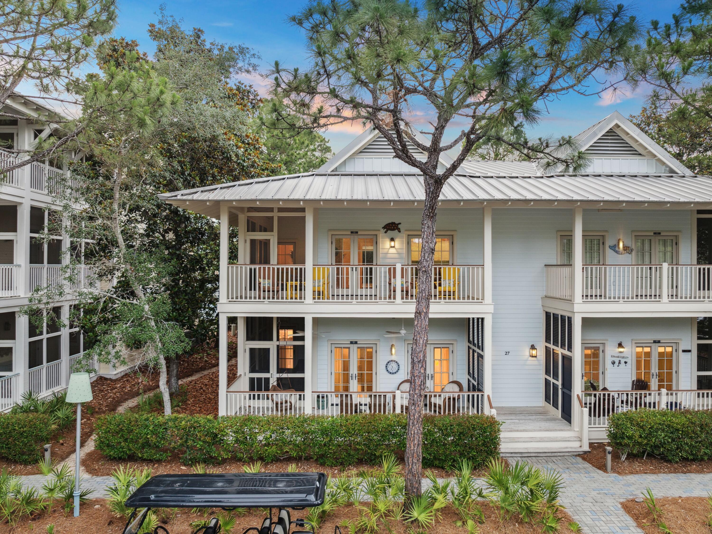 One of the rare and coveted residences overlooking iconic Cerulean Park, this beautifully curated West Indies-style condo invites you to slow down and soak in the rhythm of WaterColor living. Perched above one of the community's most picturesque greenspaces, the second-floor location offers a daily front-row seat to the sounds of trickling fountains, the rustle of palms, and the soft glow of morning light filtering through oak trees. Whether you're enjoying coffee on the porch or unwinding in the evening with a chilled drink, the view of Cerulean Park becomes part of your everyday backdrop--calming, inspiring, and unmistakably WaterColor. Meticulously maintained and never part of a rental program, this two-bedroom, two-bath retreat reflects a high standard of care and a quiet pride of ownership. Offered fully furnished and thoughtfully designed, the interior blends warmth and comfort with polished details like hardwood and tile flooring, recessed lighting, and custom window treatments. The open-concept living area extends effortlessly onto a generous 364-square-foot screened-in porch, where the lines between indoors and outdoors disappear and life naturally slows to match the serenity of the setting.

Perfectly positioned in Phase I just steps from the WaterColor Beach Club, tennis center, and white-sand shores of the Gulf, this residence offers the ultimate in both convenience and charm. With timeless design, an unrivaled location, and a legacy of gentle use, this is a rare opportunity to own a home that truly captures the essence of 30A living.
